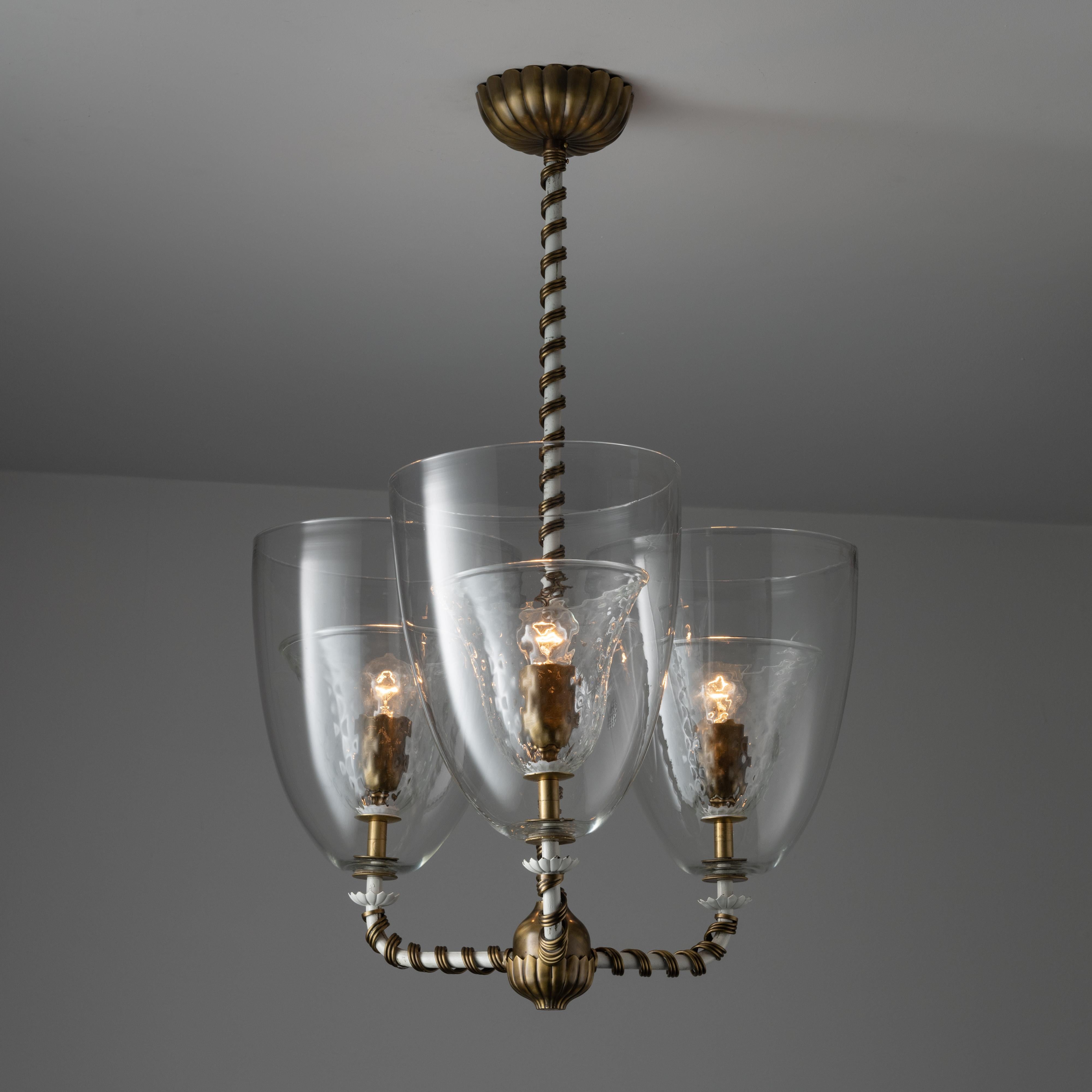 Model 5318 ceiling light by Tomaso Buzzi for Venini. Designed and manufactured in Italy, circa 1940. Three-shade ceiling light with white enameled frame and wrapped brass candy cane detailing. The shades contain an exterior glass shell and a