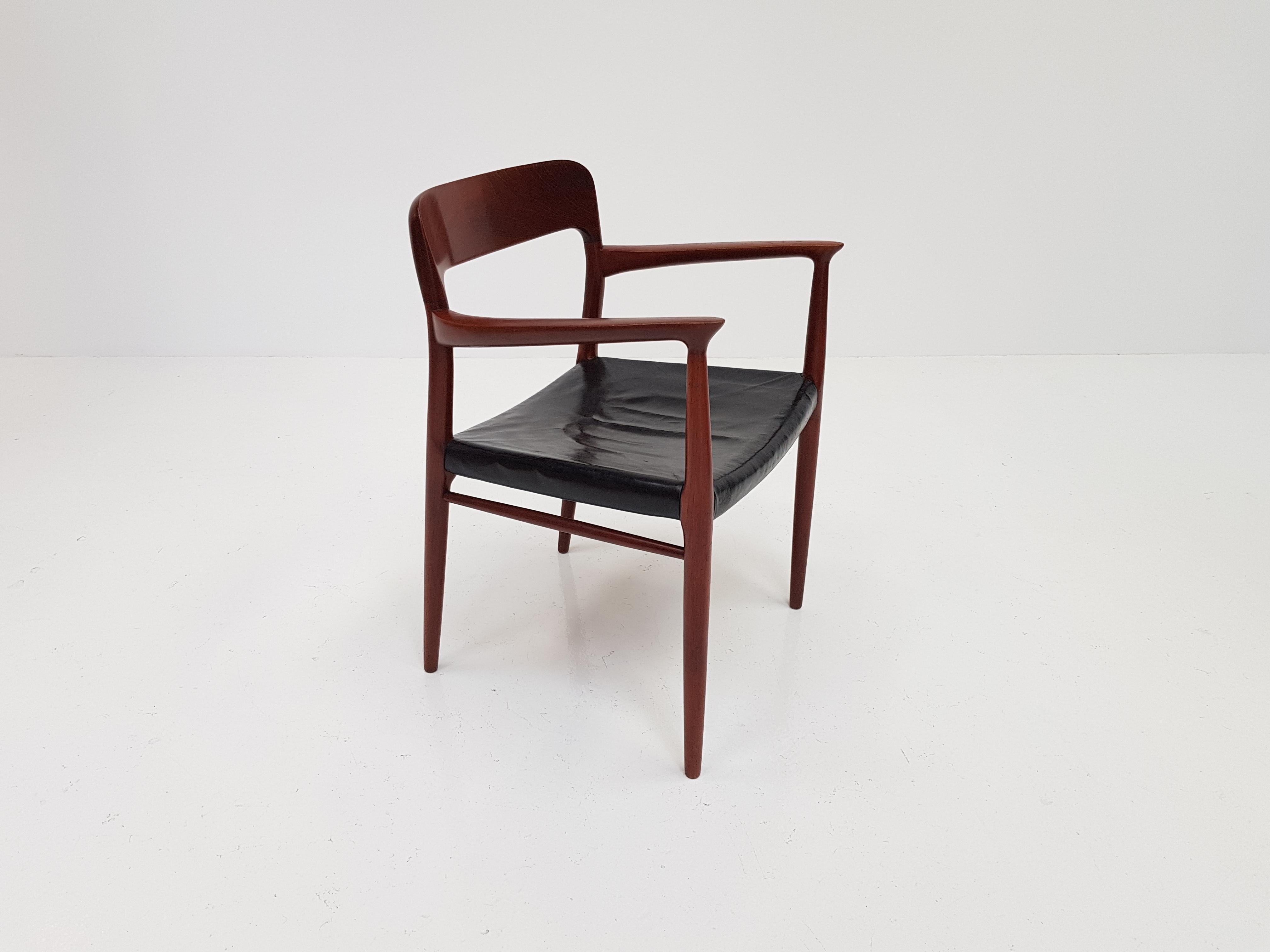 A Model 56 armchair in teak and black leather by Niels Otto Møller for J. L. Møller, Denmark, 1954.
 
A beautifully shaped frame crafted in solid teak with a seat pad covered in black leather which has great patina.


    