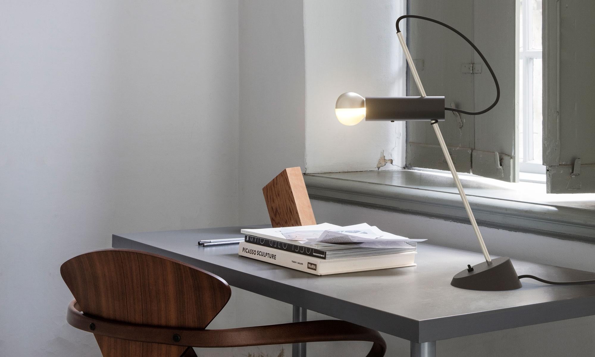 Model 566 table lamp by Gino Sarfatti. Originally designed in 1956. Current production manufactured by Astep. the Model 566 embodies Gino Sarfatti’s reductive process, resulting in a balanced elemental form. The Luminaire stands poised, with implied