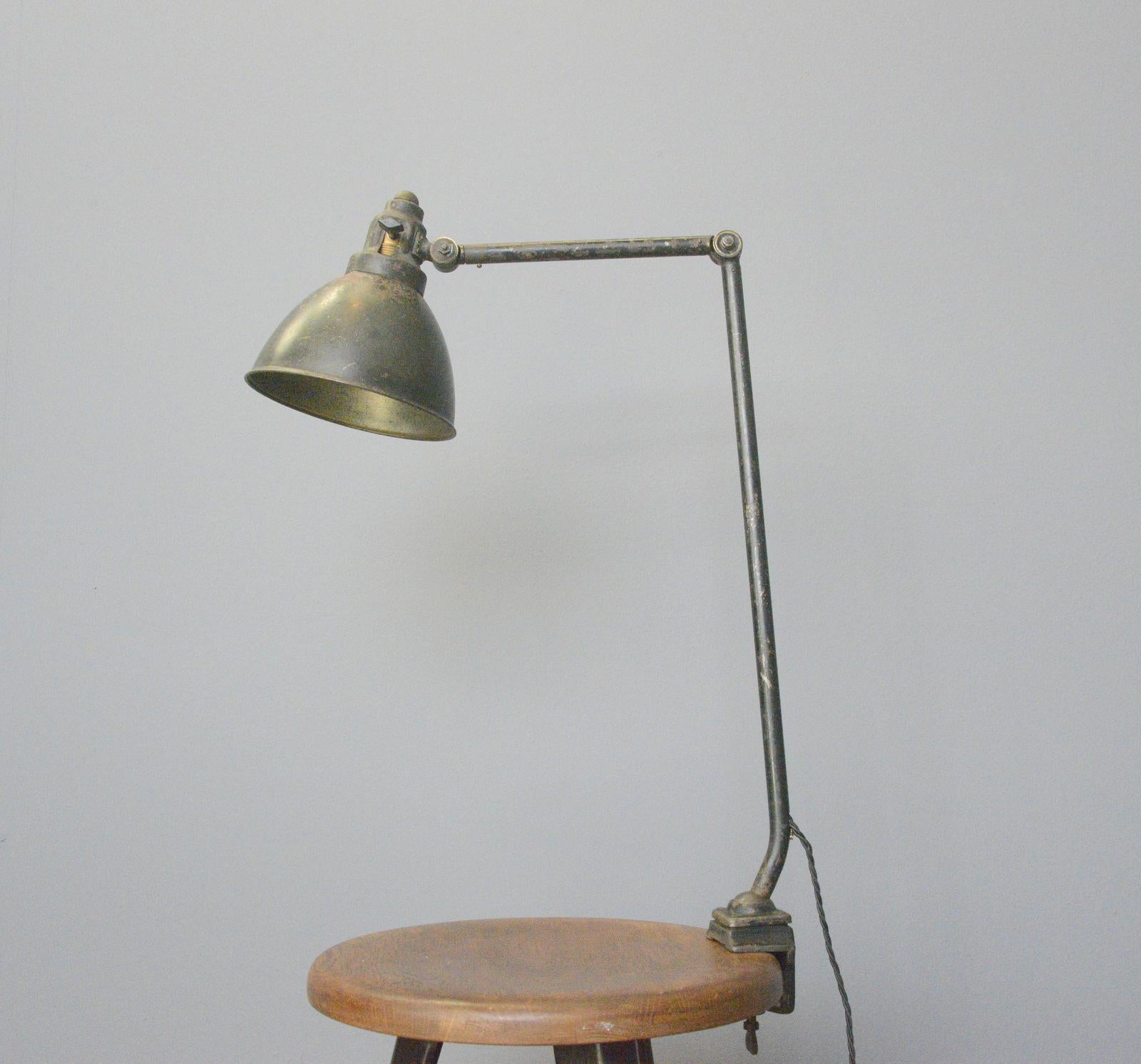 Model 574 Kandem desk lamp Circa 1920s

- Original dark green paint
- Pressed steel shade with Kandem branding
- Articulated arm and shade
- On/off switch on the shade
- Produced by Korting and Mathiesen, Leipzig
- Model 574
- German ~