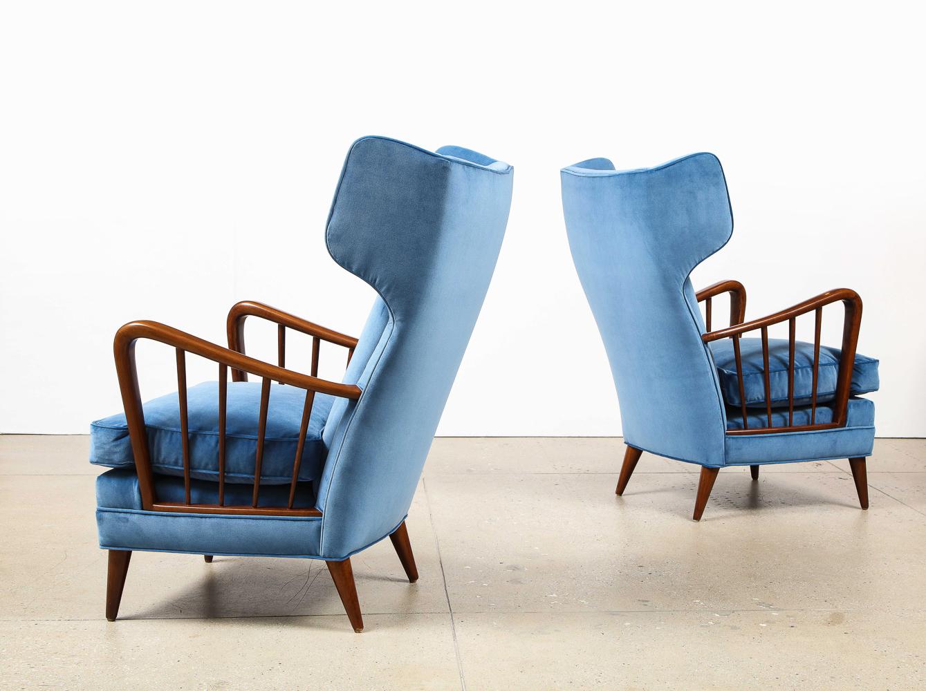 Dark-stained maple, velvet. A rare model with exaggerated wings forms. A pair of these chairs can be found in the main living room of the Villa Borsani, in Varedo, Italy. Wood has been refinished and seats re-upholstered.