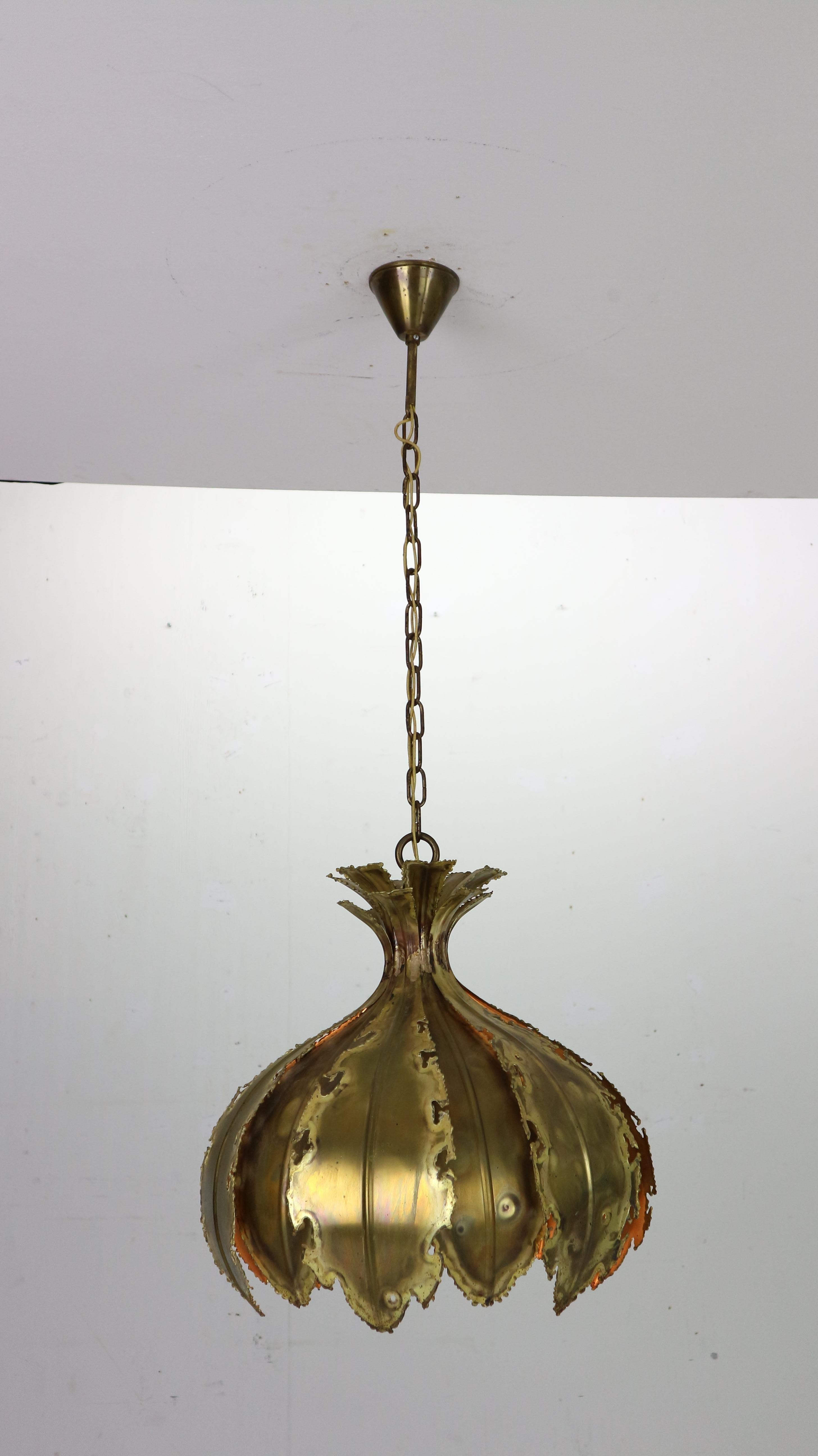 A very nice brass hanging lamp designed by Svend Aage Holm Sorensen for Holm Sorensen & Co – Denmark, 1960s.
Danish modern Brutalist patinated brass pendant lamp named The Onion. The brass petals are torch cut and acid treated for effect - Holm