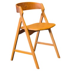 Modelo 71 Silla de teca y cuero de Henning Kjærnulf