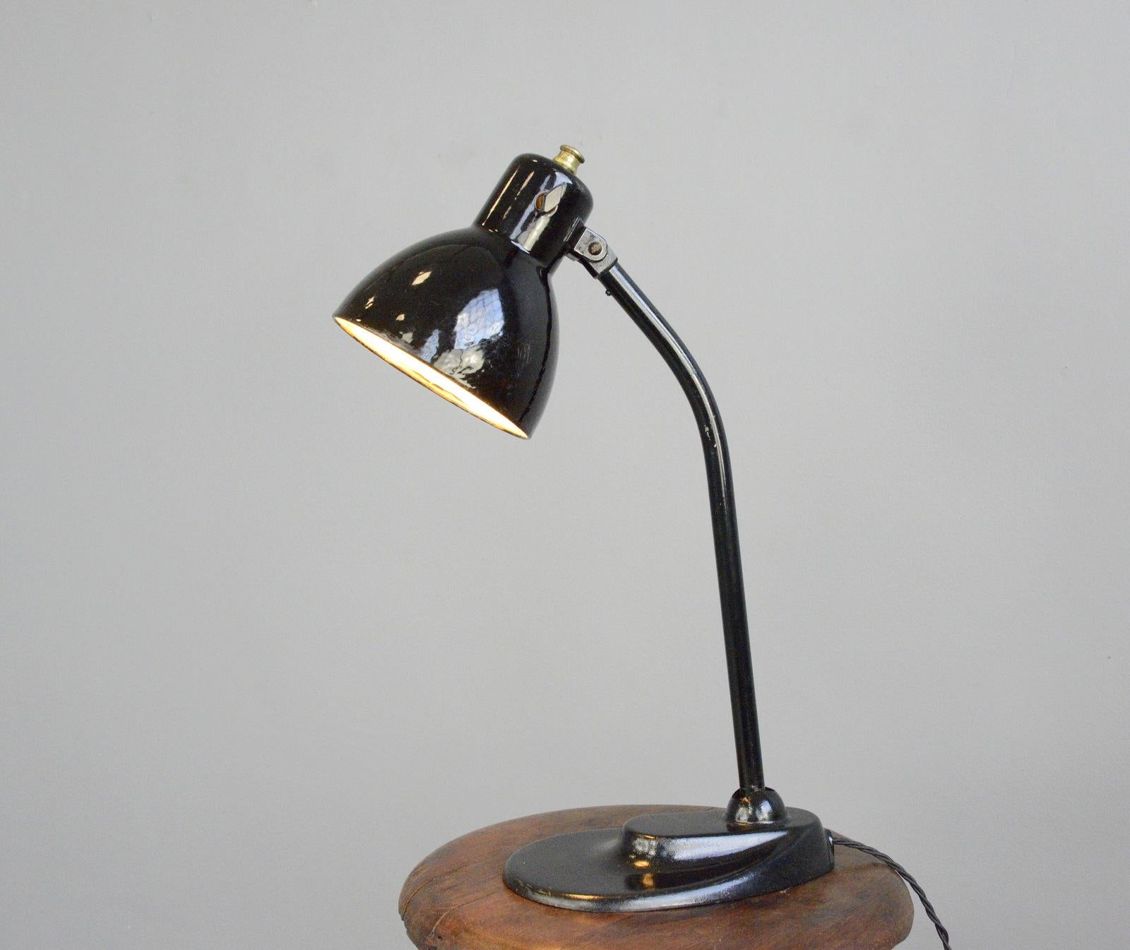 Model 752 table lamp by Kandem, circa 1930s.

- Vitreous black enamel shade
- Cast iron foot with curved steel arm
- Adjustable shade and arm
- Original bakelite On/Off toggle switch
- Takes E27 fitting bulbs
- Designed by Hin Bredendieck &