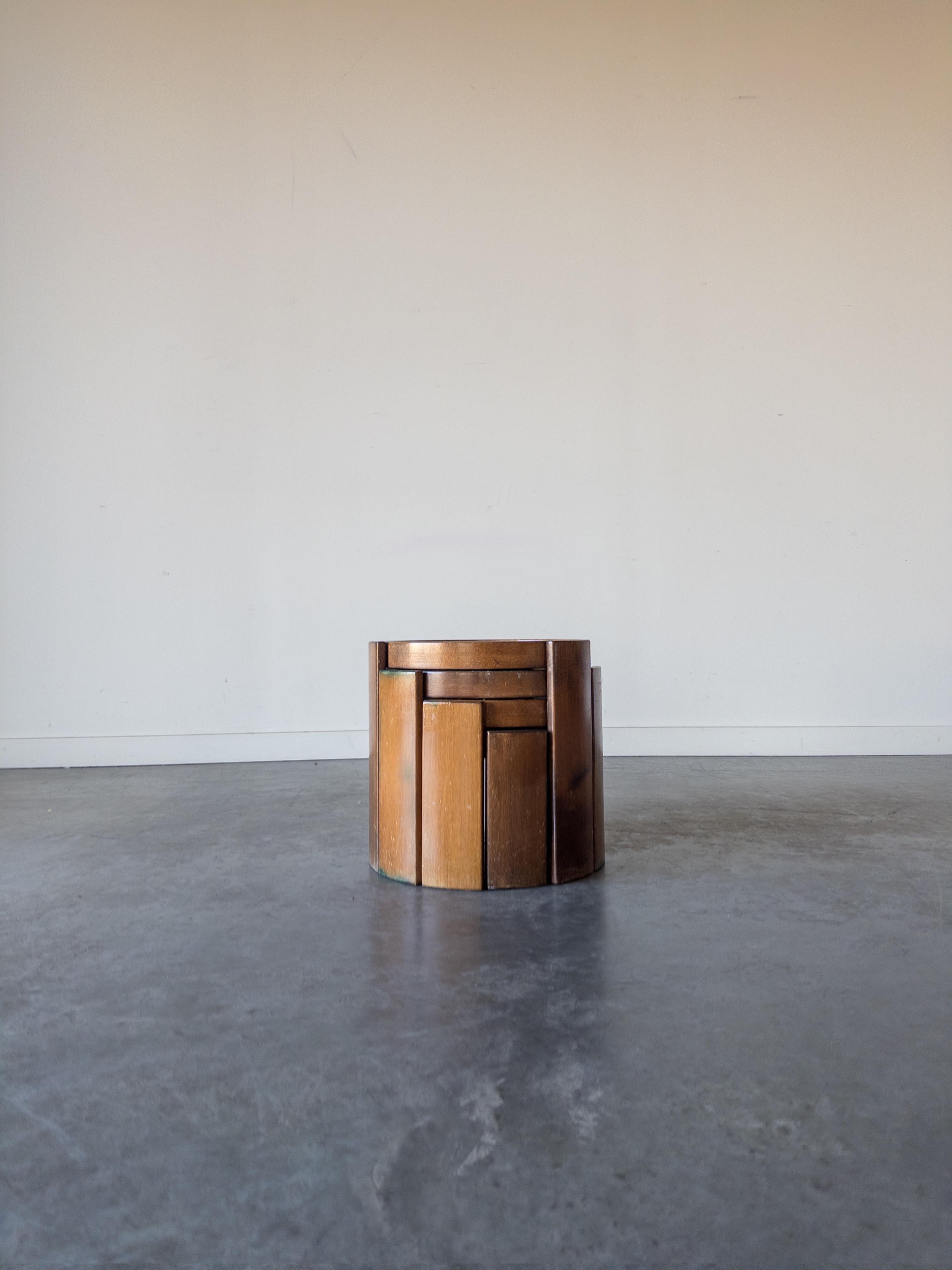 A set of 4 ‘Model 780’ modular nesting tables designed by Gianfranco Frattini for Cassina in 1966. Crafted from solid walnut in a rich finish, these side tables feature laminated tops with reversible black and white sides, providing an element of