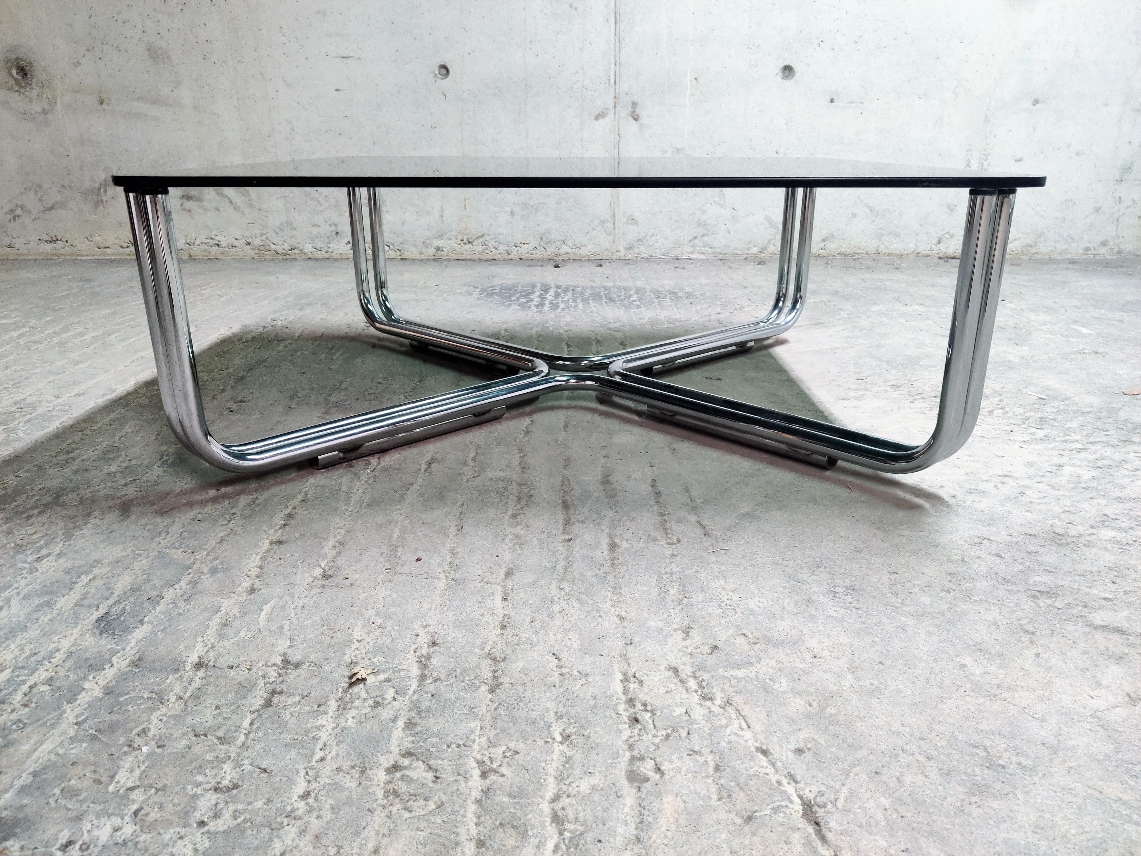 Tubular chrome coffee table with a smoked glass top designed by Gianfranco Frattini for Cassina.

'Model 784'.

Very good condition

1960s, Italy

Measures: Height 35cm/13.77