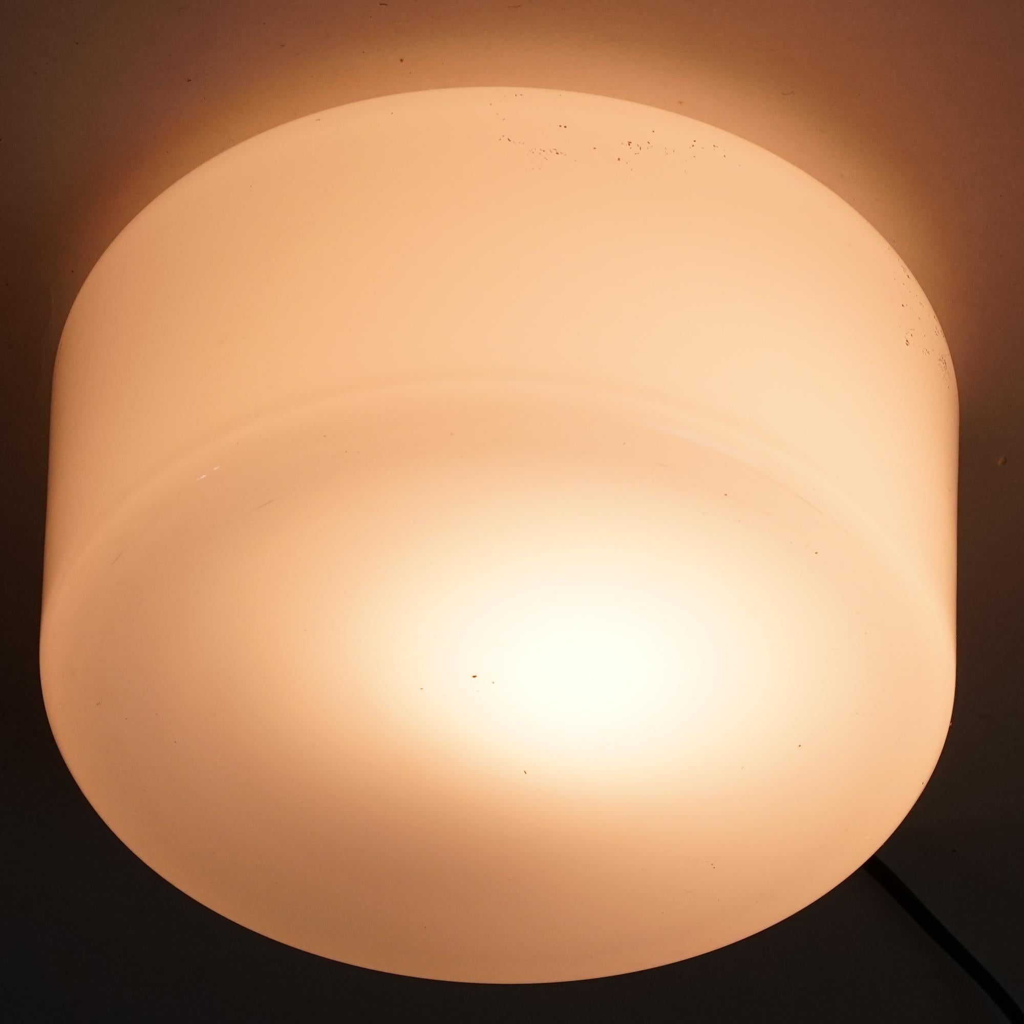 Model 80112-25 flush mount by Idman Oy from the 1950s. Milk glass and metal. Manufacturer's stamp in the bottom. Good vintage condition, minor patina and wear consistent with age and use. 