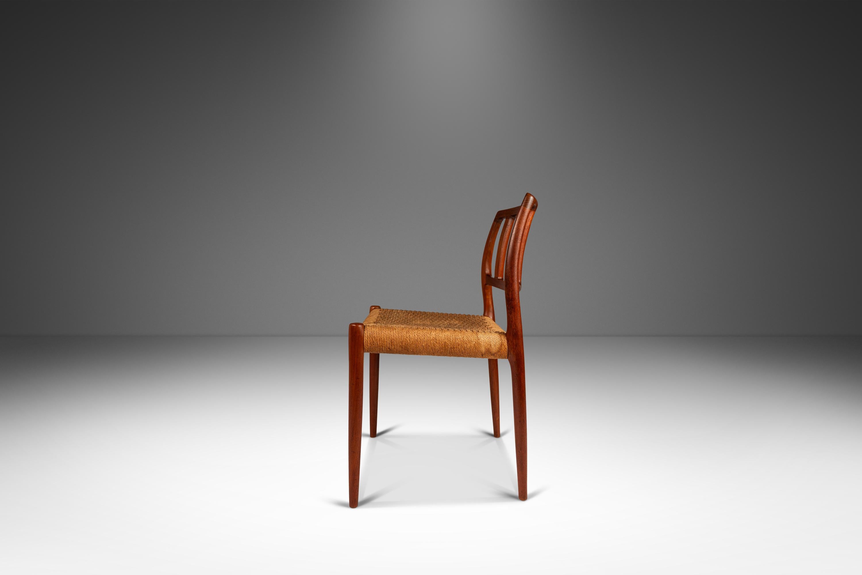 Introducing a rare Niels Otto Moller Model 83 side chair for J.L. Mollers Mobelfabrik, crafted in the 1960s in Denmark. This stunning chair is constructed from solid teak, showcasing the natural beauty of the woodgrain and unique coloration. The