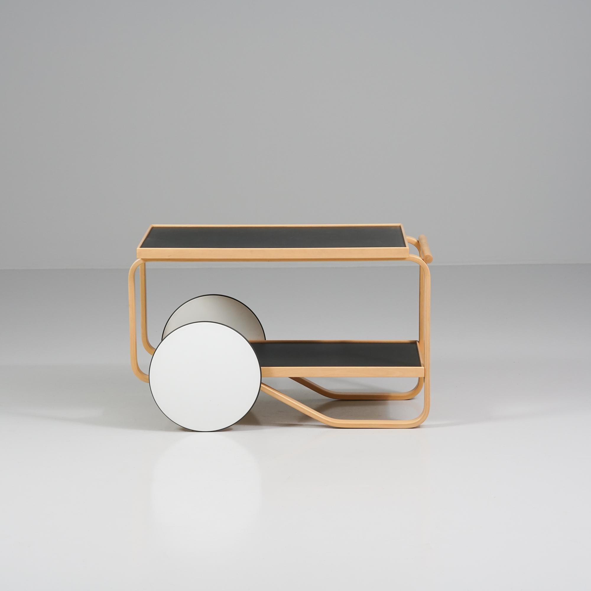 Model 901 tea cart, designed by Alvar Aalto, manufactured by Artek, 1980/1990s. Birch frame, linoleum table top. Good vintage condition, patina consistent with age and use. 

Alvar Aalto (1898-1976) is probably the most famous Finnish architect and