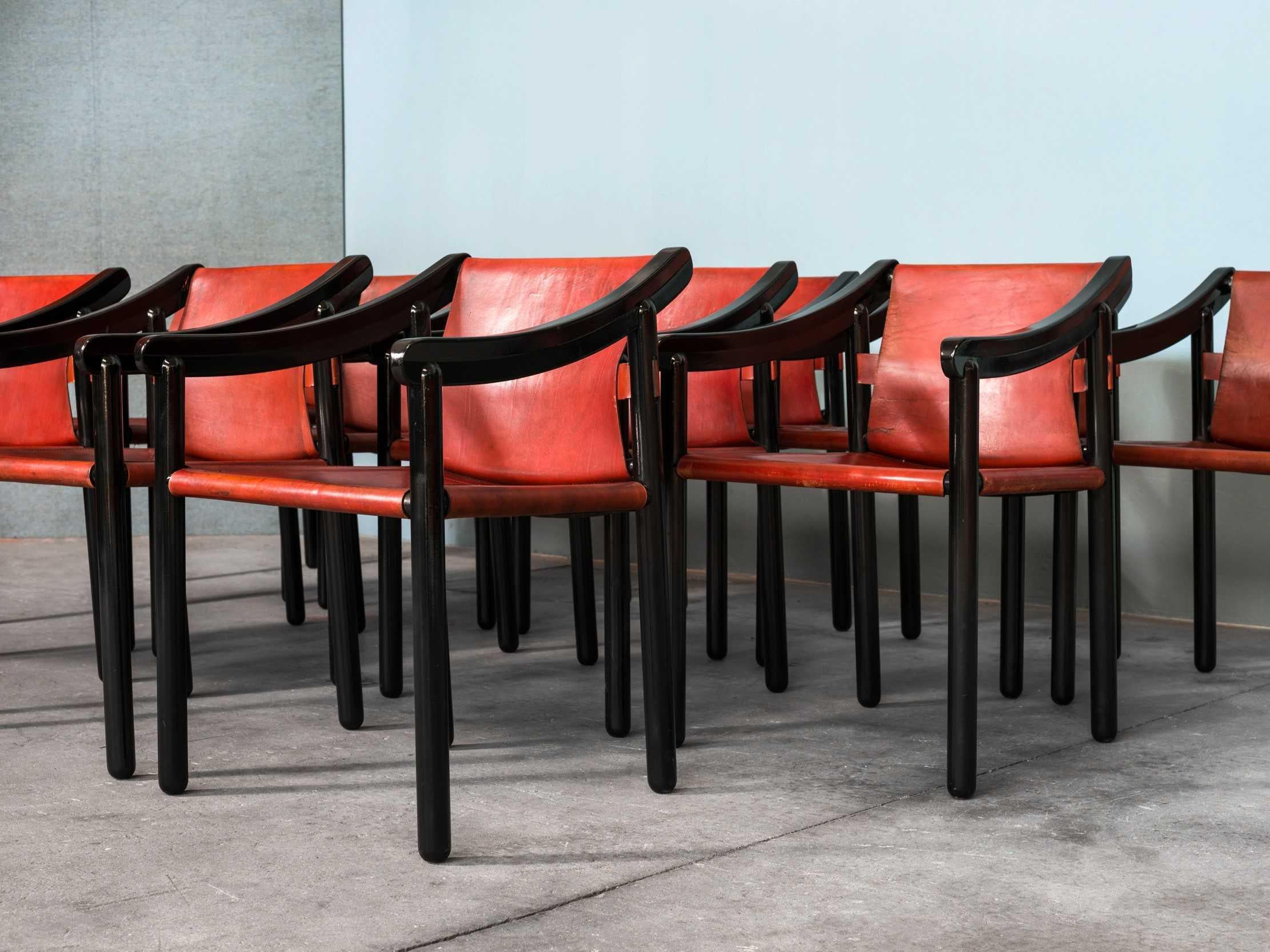 Designed by Vico Magistretti for Cassina in 1964, the 905 chair is characterised by cylindrical legs, arched armrests and the use of saddle leather to enhance its elegance. The 905’s complex workmanship results in a seemingly simple chair,