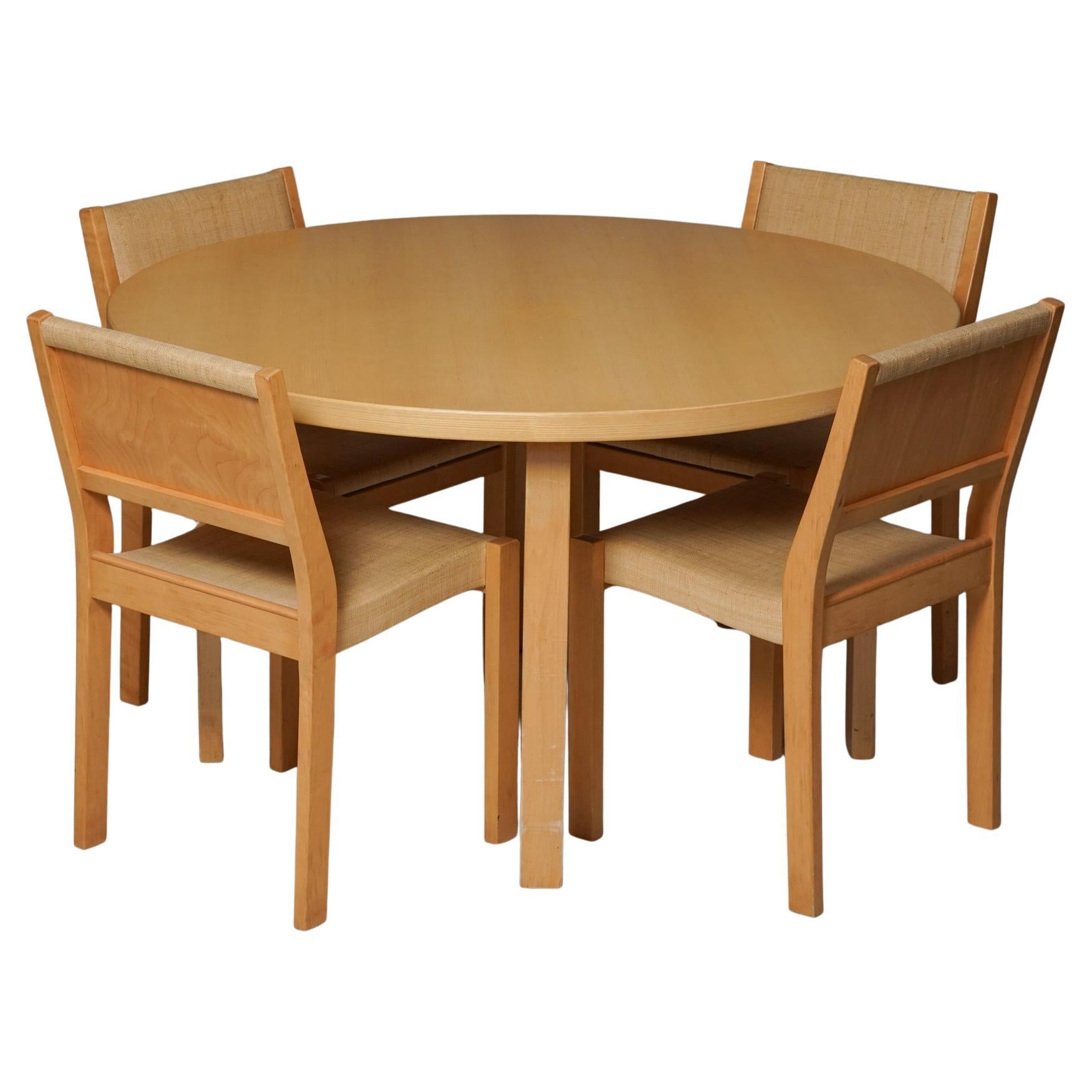 Model 91 dining table with four model 611 chairs, designed by Alvar Aalto, manufactured by Artek, 1960s. Birch frame. The chairs have a rare rattan style -fabric (niinikangas). Good vintage condition, patina consistent with age and use. The table