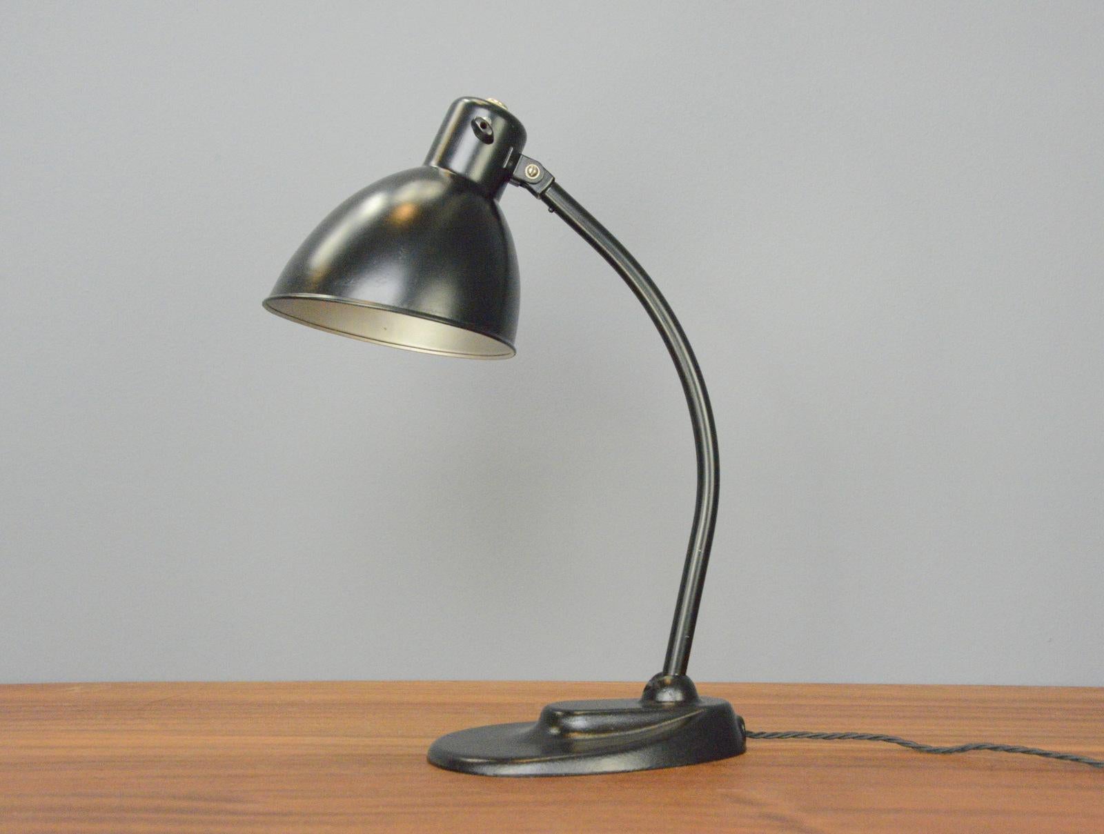 Model 999 Kandem desk lamp Circa 1930s

- Cast iron base
- Angled steel shade
- Articulated arm and shade
- Original on/off switch on the shade
- Model 999
- Produced by Korting and Mathiesen, Leipzig
- German ~ 1930s
- 49cm tall x 14cm