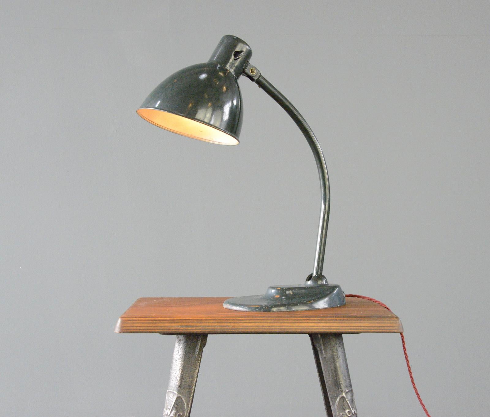 Model 999 Kandem Desk Lamp Circa 1930s

- Cast iron base
- Original dark green paint
- Angled steel shade
- Articulated arm and shade
- On/off toggle switch on the shade
- Produced by Korting and Mathiesen, Leipzig
- Model 999
- German ~ 1930s