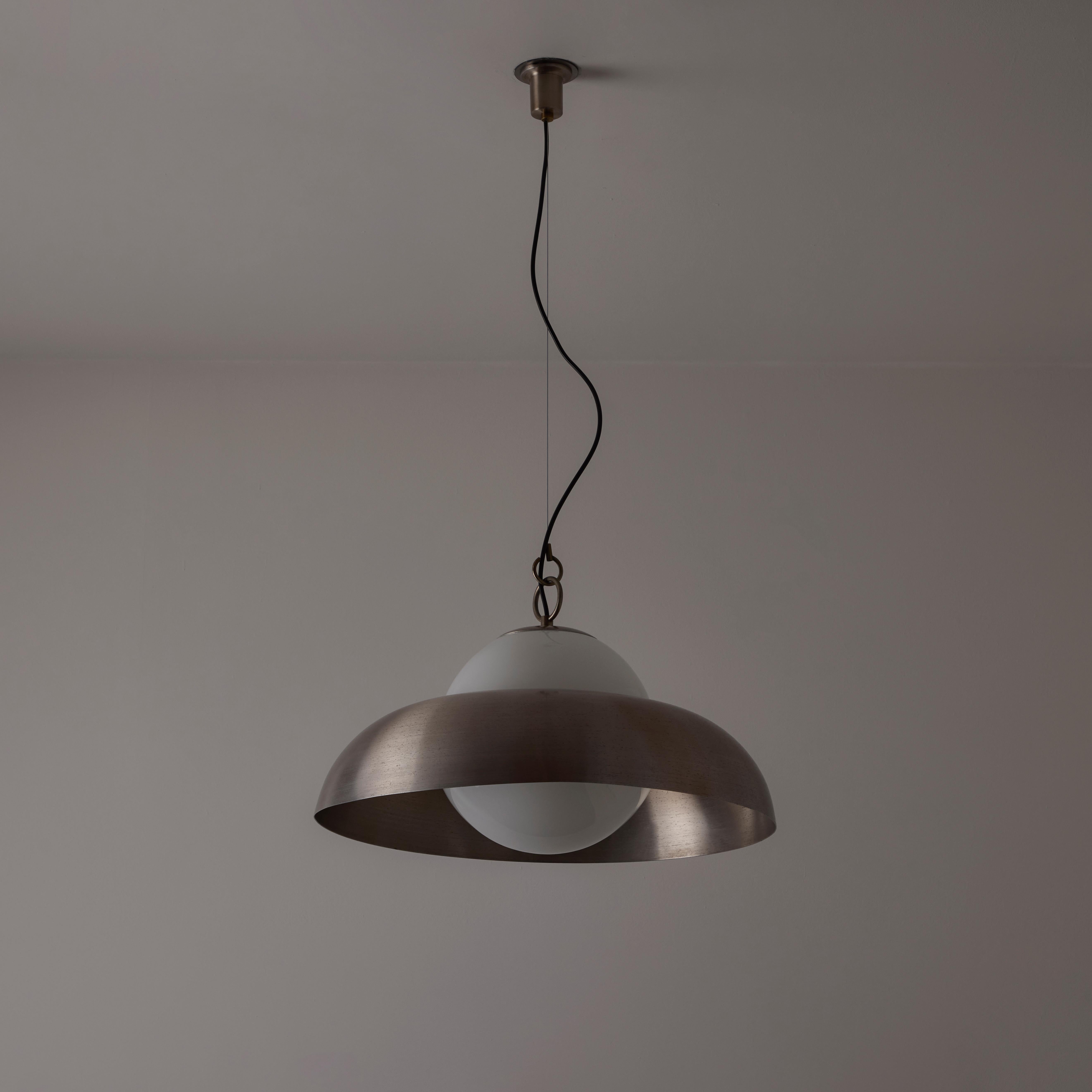 Metal and milk glass suspension lamp model A288 by Sergio Asti produced for Candle. Made in Italy, 1970. An opaline glass orb with a lipped center ring allows for the brushed nickel shade to gently rest on top of the glass. The pendant is adjustable