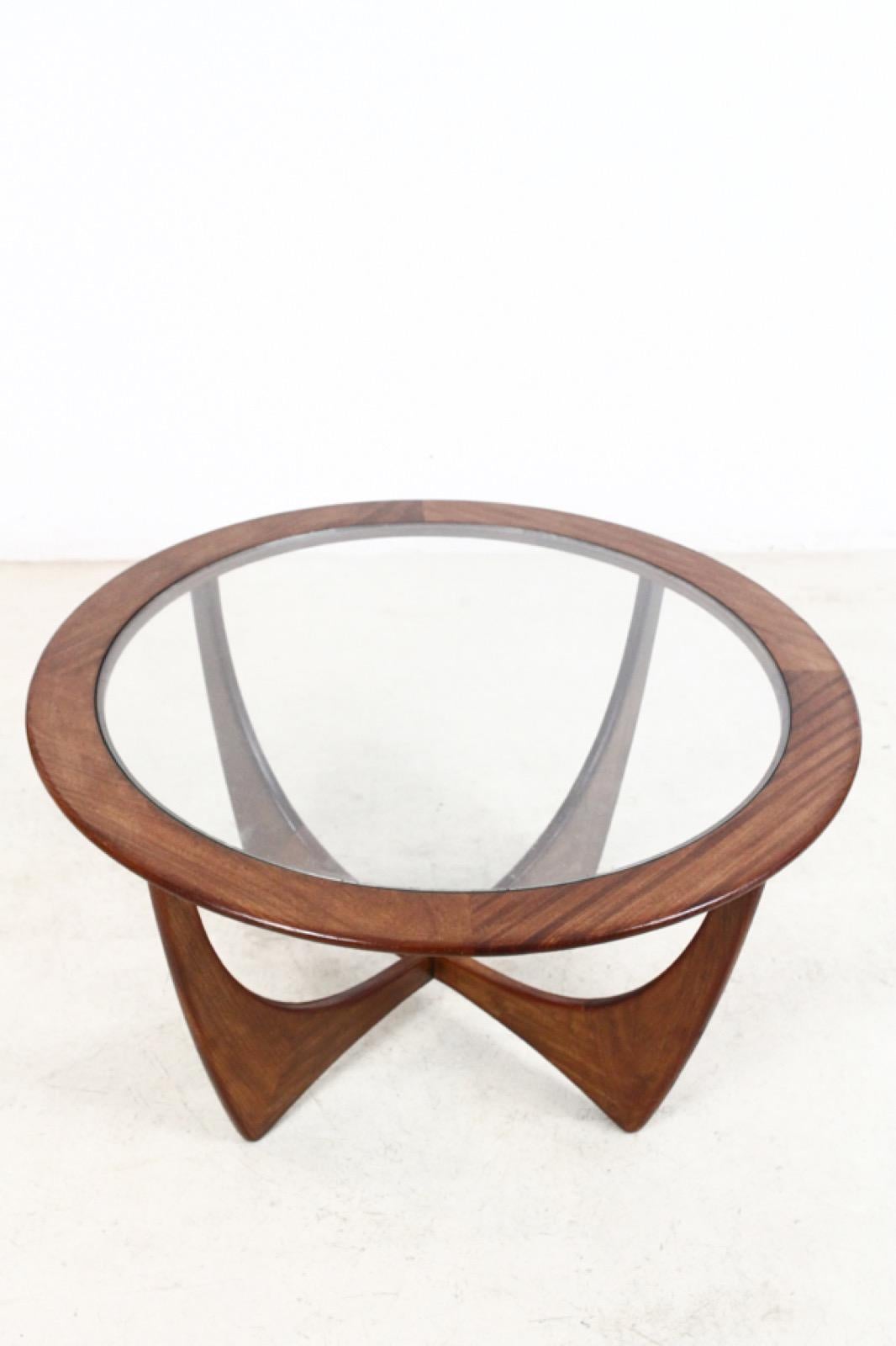This model Astro round stained teak and glass coffee table was designed by Victor Wilkins for G-Plan and was produced in England, circa 1960s. It is made from teak with a glass top and remains in a very good vintage condition. If you ever wondered