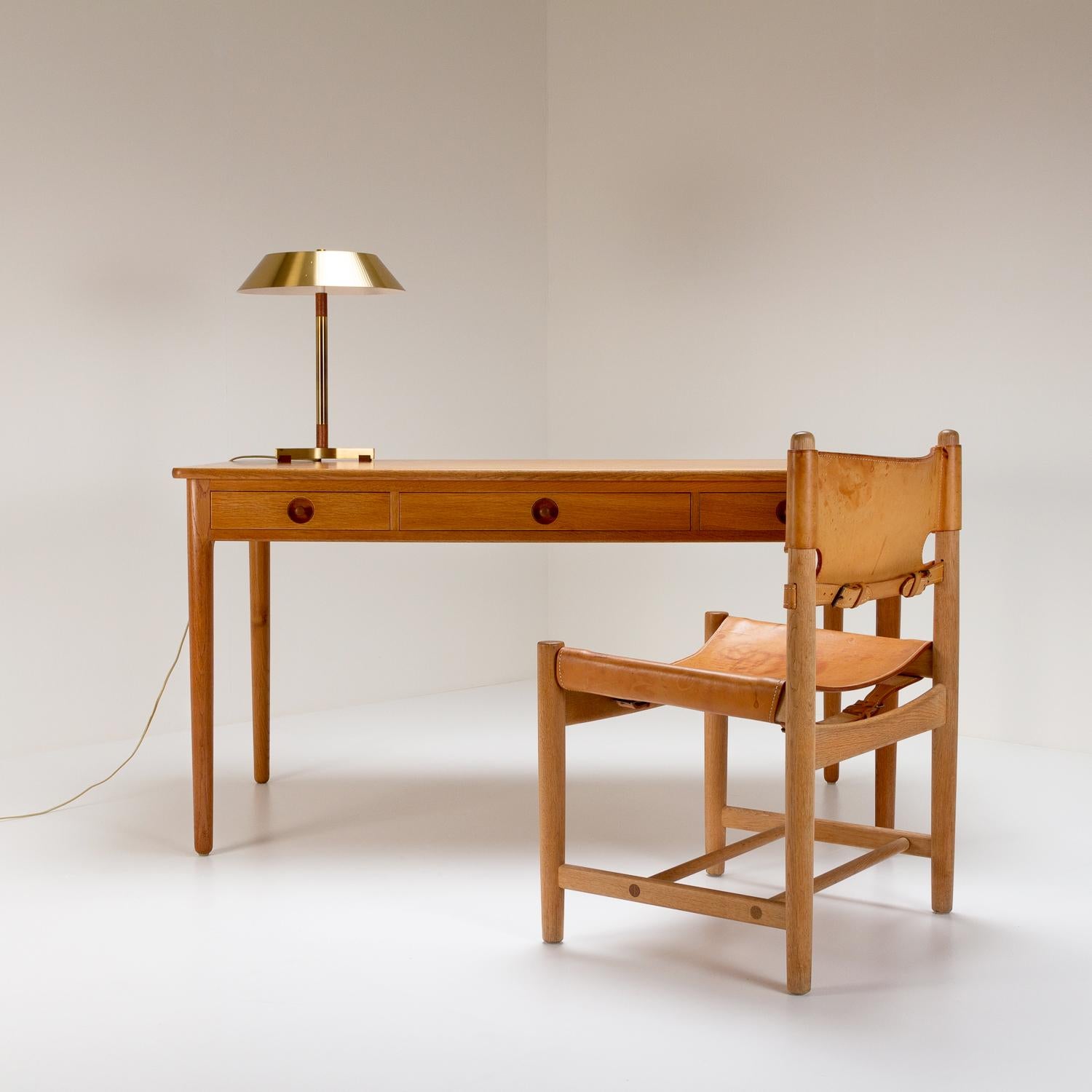 A solid oak writing desk designed by Hans Wegner and made by master cabinetmaker Andreas Tuck in Denmark in the 1950s. Excellent quality as expected from Wegner and Tuck, one of Denmark’s greatest mid-century working partnerships. There is a very