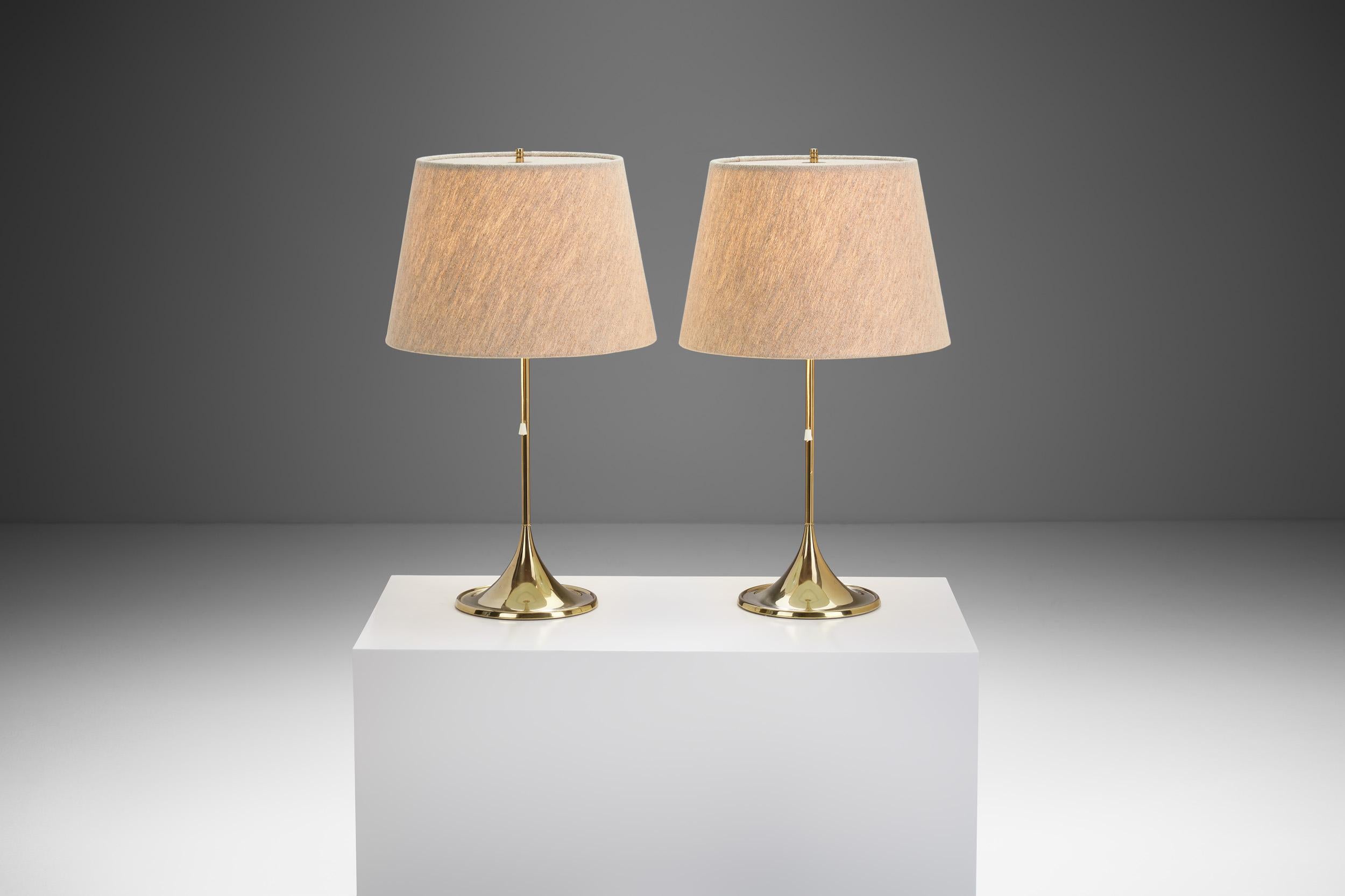 This pair of elegant table lamps was produced by Bergboms in Sweden during the 1960s. The design was created by Alf Svensson and Yngvar Sandström, both of whom were brilliant Swedish designers of the era.

These lamps have a classic, inherently