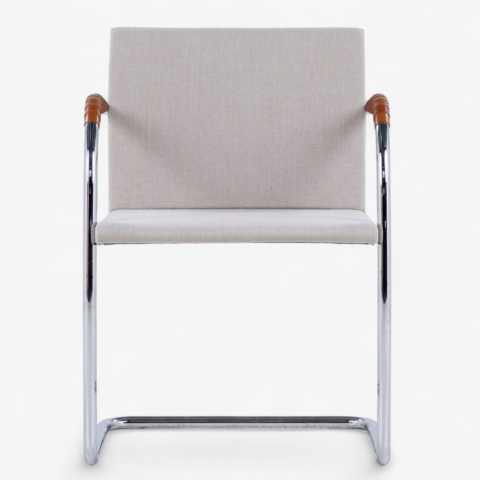 Model 'Brno': Set of four 'Free-wing' chairs in chromed steel and canvas with armrests in natural leather. Designed in 1930 by Ludwig Mies van der Rohe.