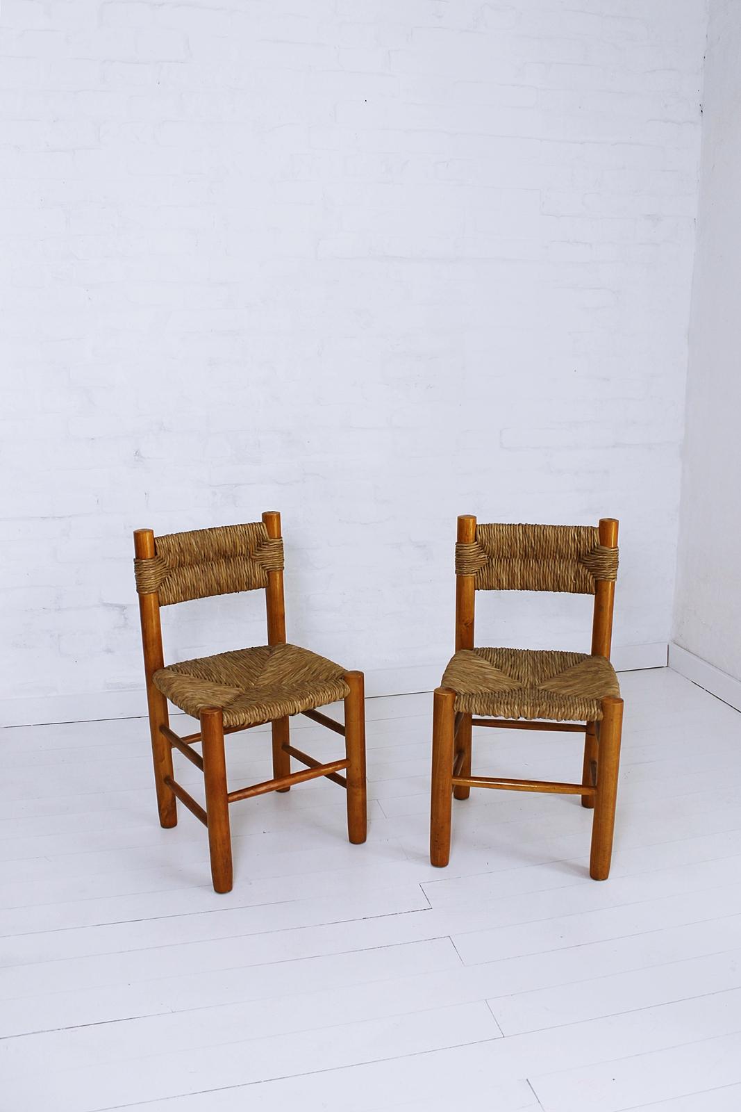 Chair features a wood frame wrapped in straw.
Designed by Charlotte Perriand for Robert Sentou.
Chairs are named Dordogne in reference to the river located in the Correze region, France.