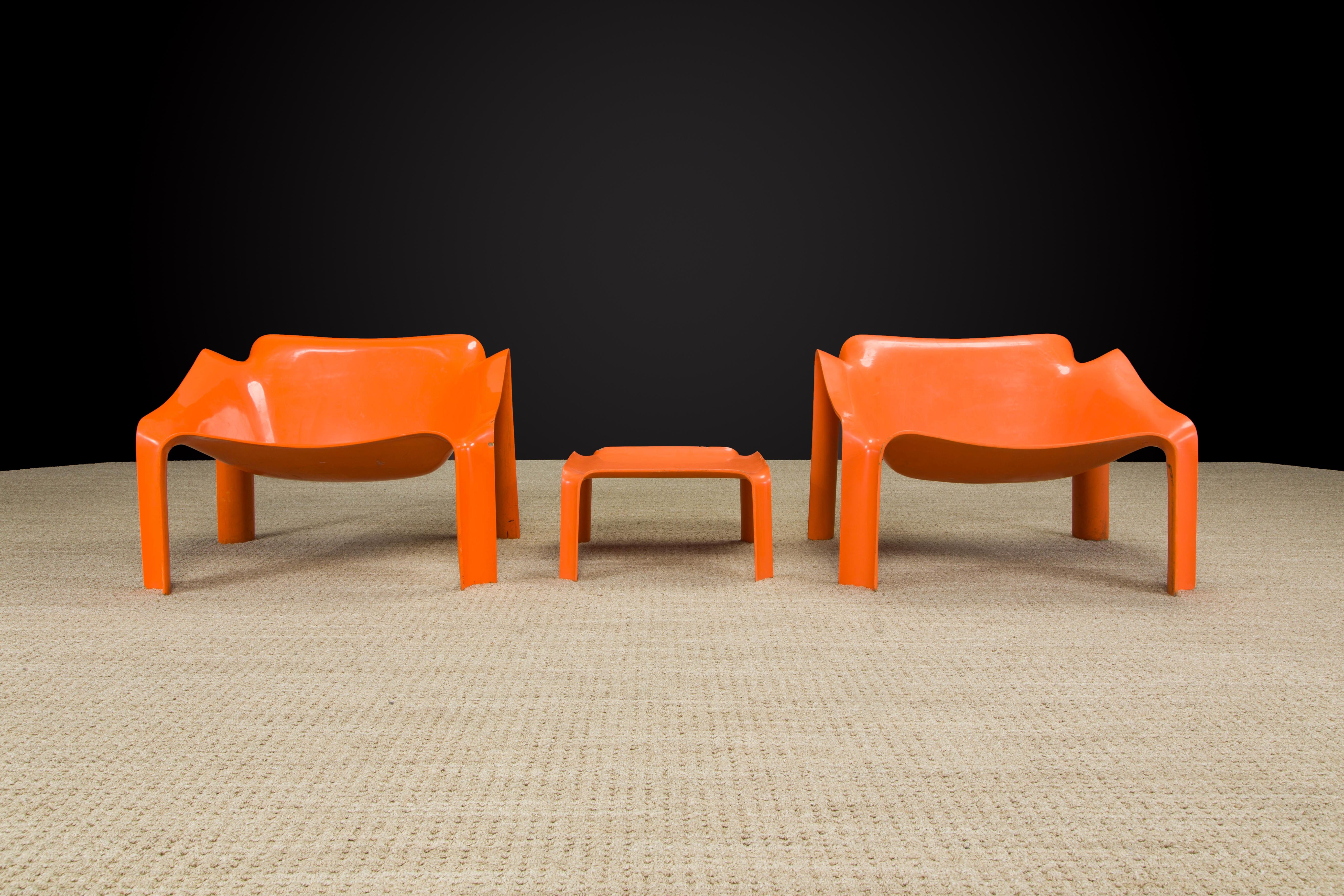 This rare set of Model 'F303' lounge chairs (2) and side table (1) by Pierre Paulin for Artifort was designed and produced in the 1970s and still an icon of 70s modern design to this day. 

Crafted with a hard polyurethane molded shell which is