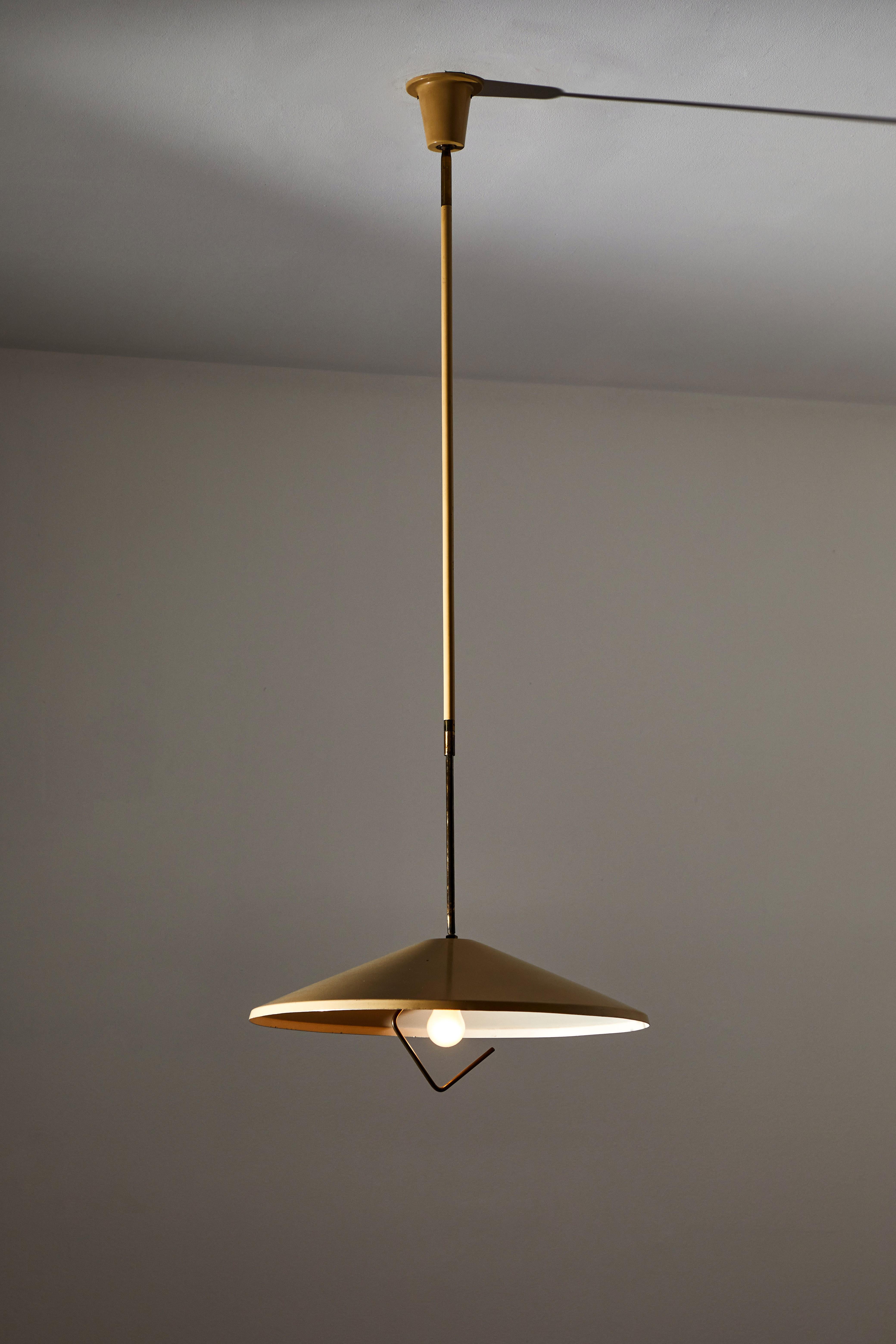 Model G6 Suspension Light by Bruno Gerosa for Lumen. Designed and manufactured in Italy, circa 1950s. Brass, painted aluminum. Rewired for U.S. standards. Original canopy, custom ceiling plate. Ball joint at top of fixture adjust 360 degrees. Height