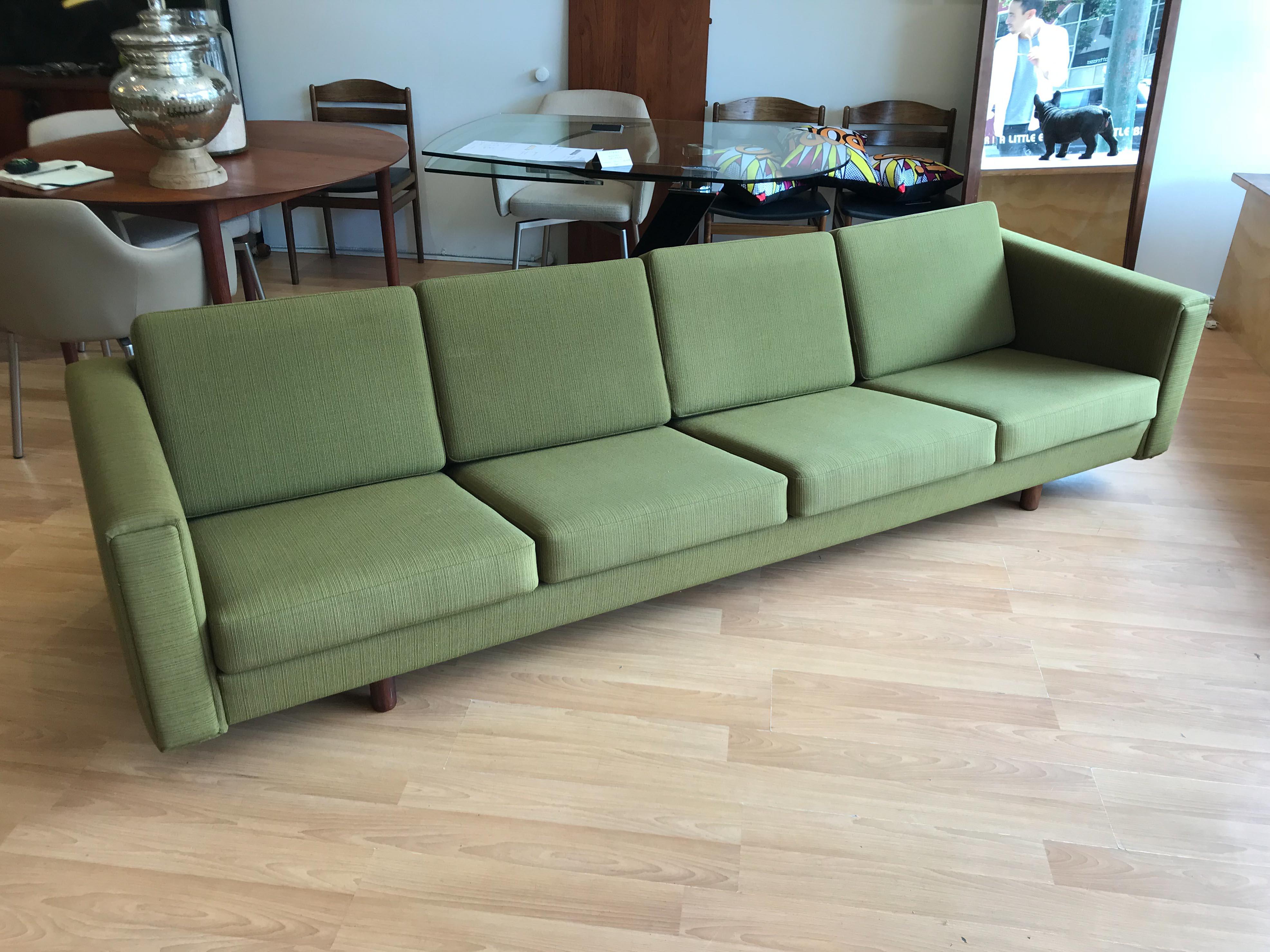 Rare model GE-300 four-seat sofa by Hans J. Wegner of GETAMA. Early edition in excellent original condition with what is thought to be it's original upholstery. Walnut legs, innerspring cushions and solid wood frame, a beautiful example of the model.