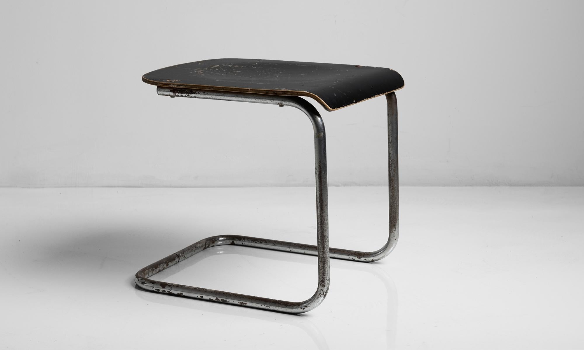 Chrome plated bent steel with lacquered plywood seat.