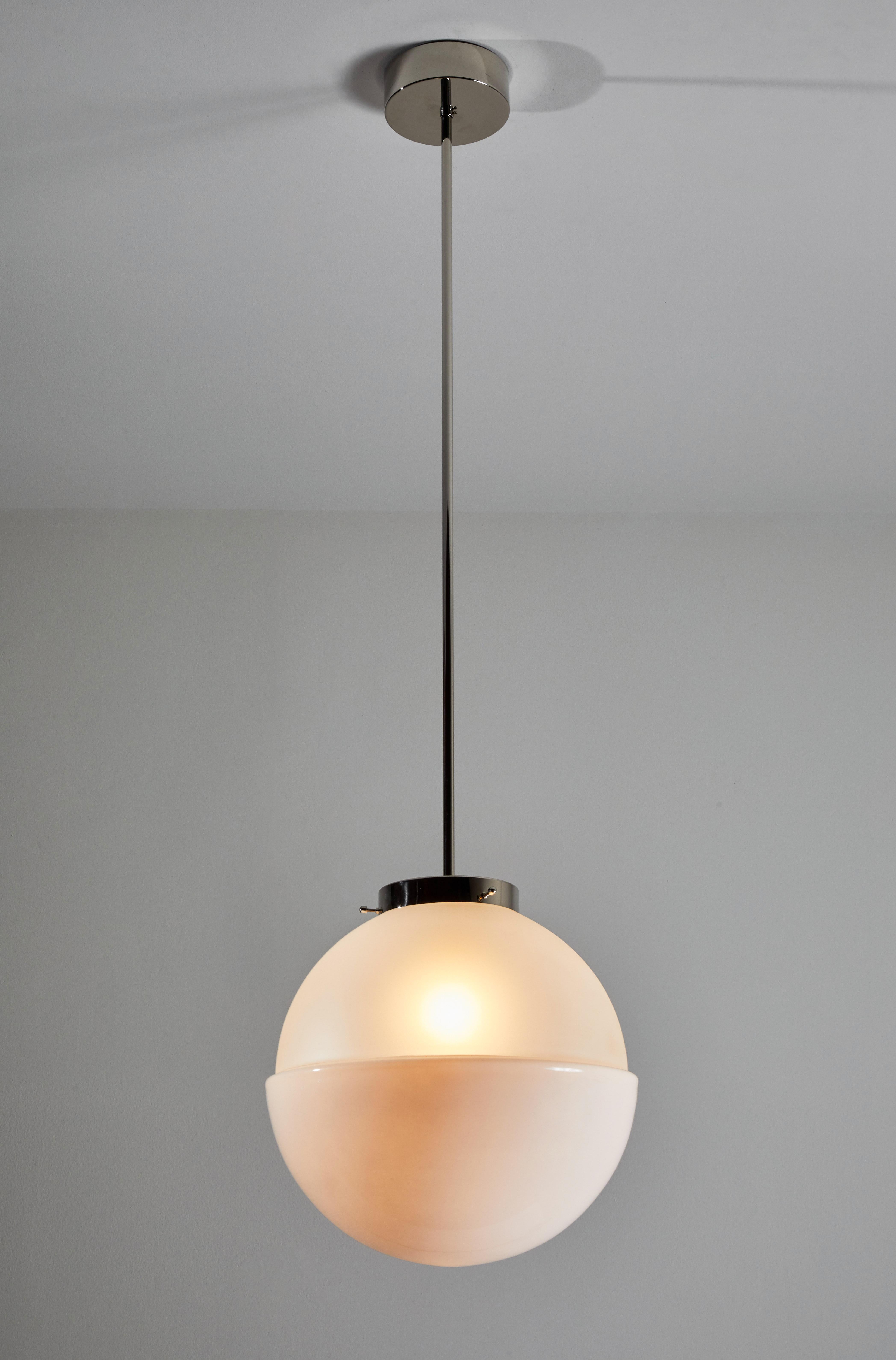 HMB 29/400 pendant by Marianne Brandt. Manufactured in Germany by Tecnolumen. This is a current production that was originally designed in 1928. Nickel plated hardware, opaque and frosted glass diffuser. Rewired for U.S. junction boxes. Takes one E
