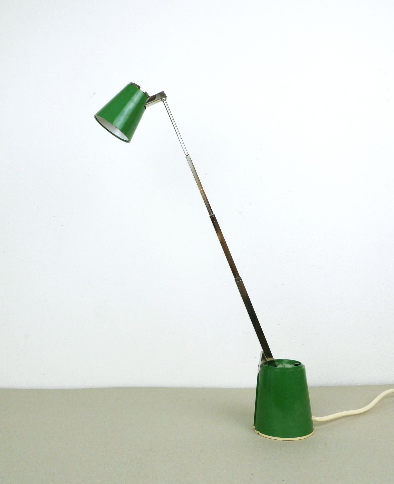 This multifunctional tripod lamp, model Lampette, was produced by the German manufacturer Eichhoff in the 1960s. The lamp can be folded to a compact size of 15 cm to serve as a reading light when traveling. A firm stand is ensured by a fold-out