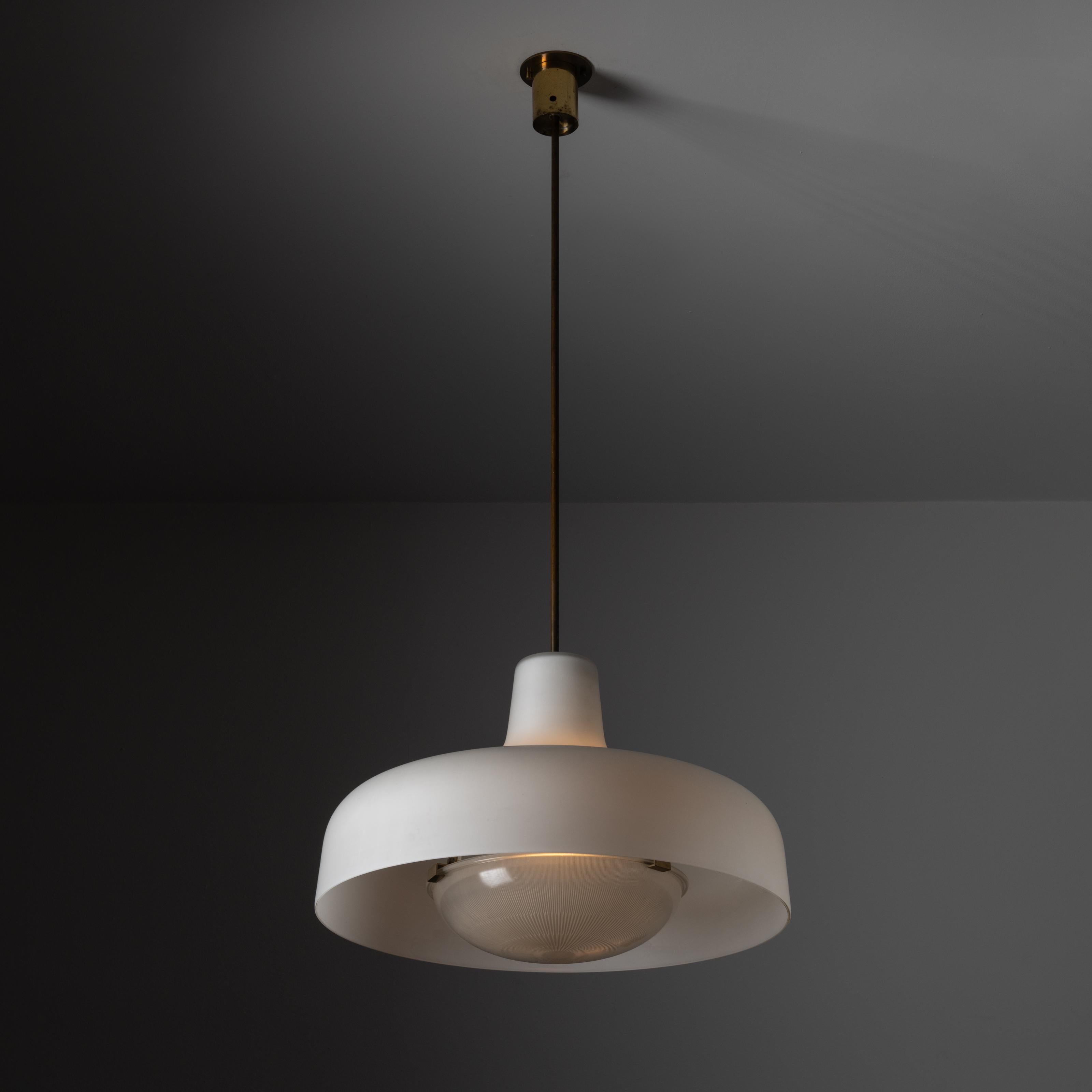 Model LS7 'Paolina' ceiling light by Ignazio Gardella for Azucena. Designed and manufactured in Italy, 1958. Exterior white glass, brass fixture stem and canopy, with reeded glass diffuser at the bottom. Original canopy, custom brass backplate. The