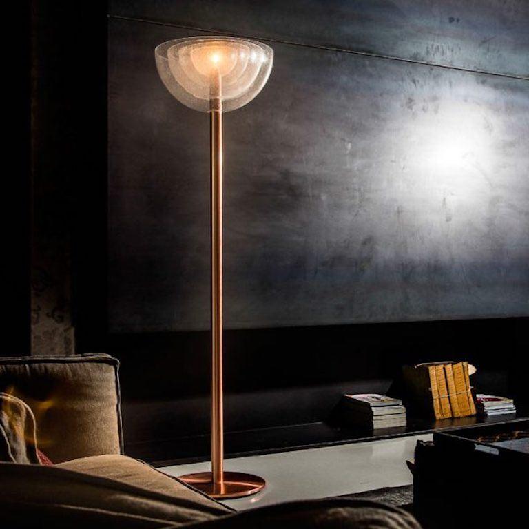 Model LT 338 floor lamp by Carlo Nason. Originally designed in 1967. Current production by Mazzega designed and manufactured in Italy. Brushed copper, polished bronze. Hand blown crystal glass. Rewired for U.S. standards. Four semi circular hand