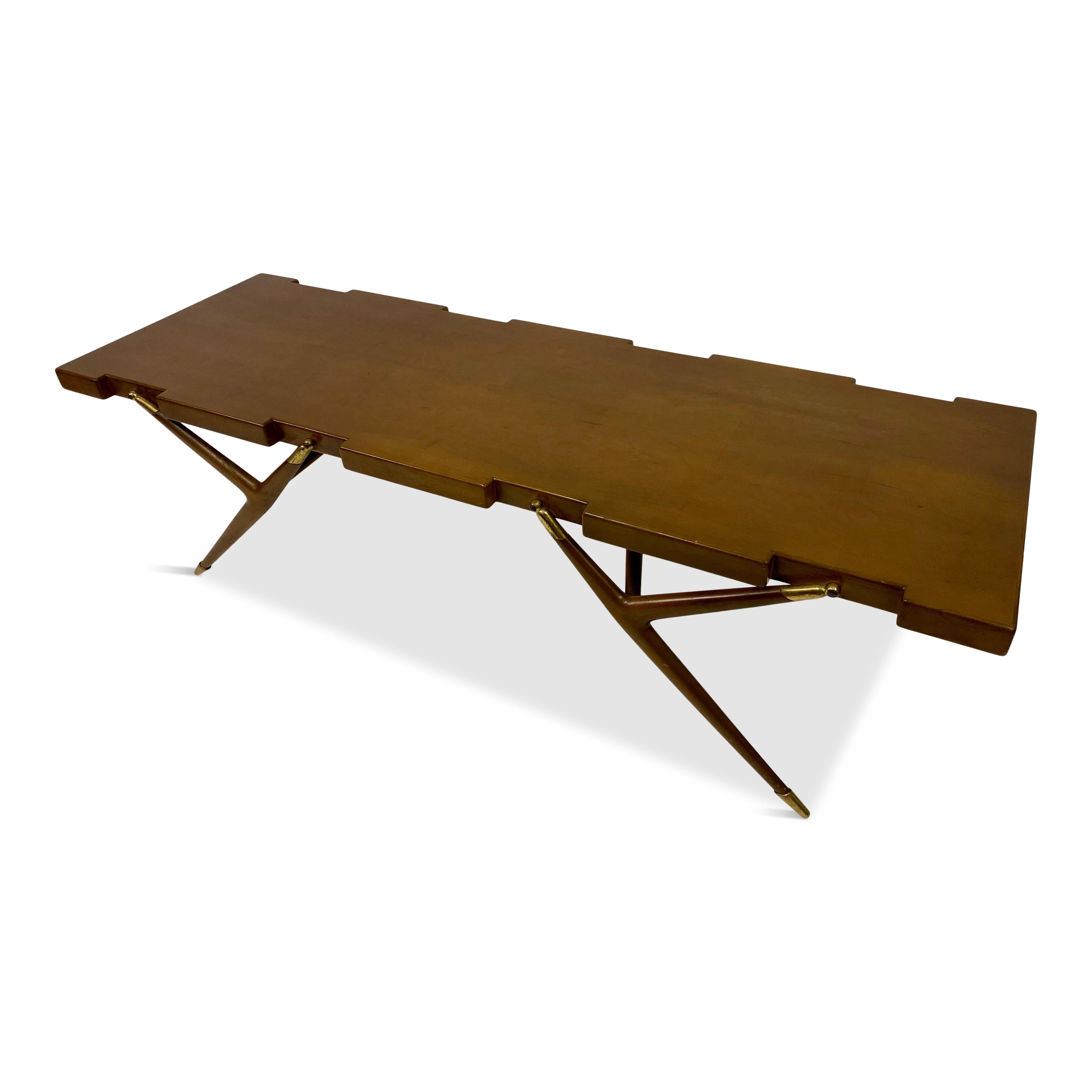 Coffee table

By Ico Parisi

Model Number 1116

Manufactured by Fratelli Rizzi, Intimiano, Italy

Retailed by Singer & Sons, New York 

Made exclusively for the American market

Walnut veneered wood, walnut and brass

Applied Singer & Sons