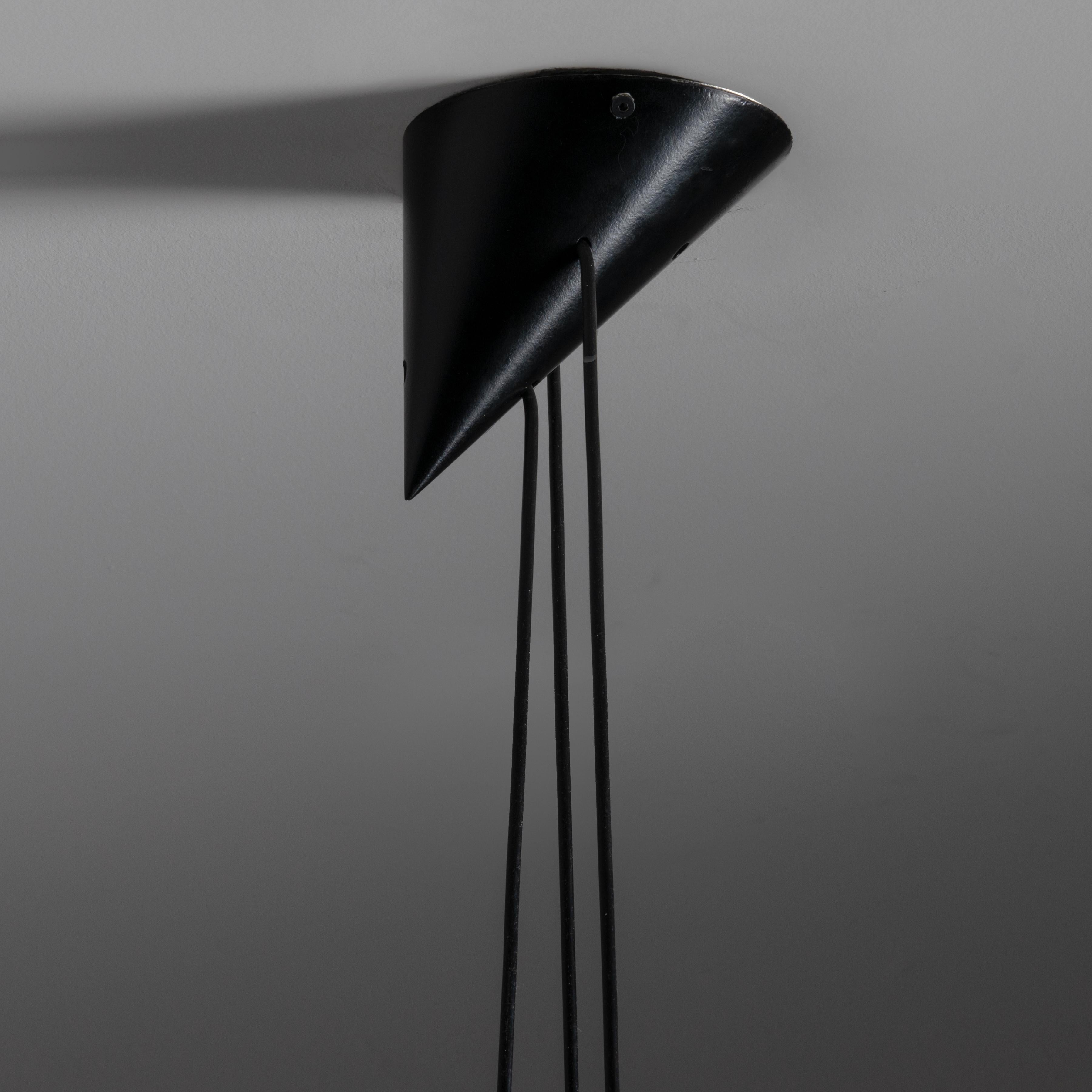 Model no. 16519 'Bille Lamp' by Bent Bille for Louis Poulsen. Designed and manufactured in Denmark, circa the 1950s. Black lacquered aluminum shade in a simple and elegant conical shape. The canopy features a close representation of the shade shape,