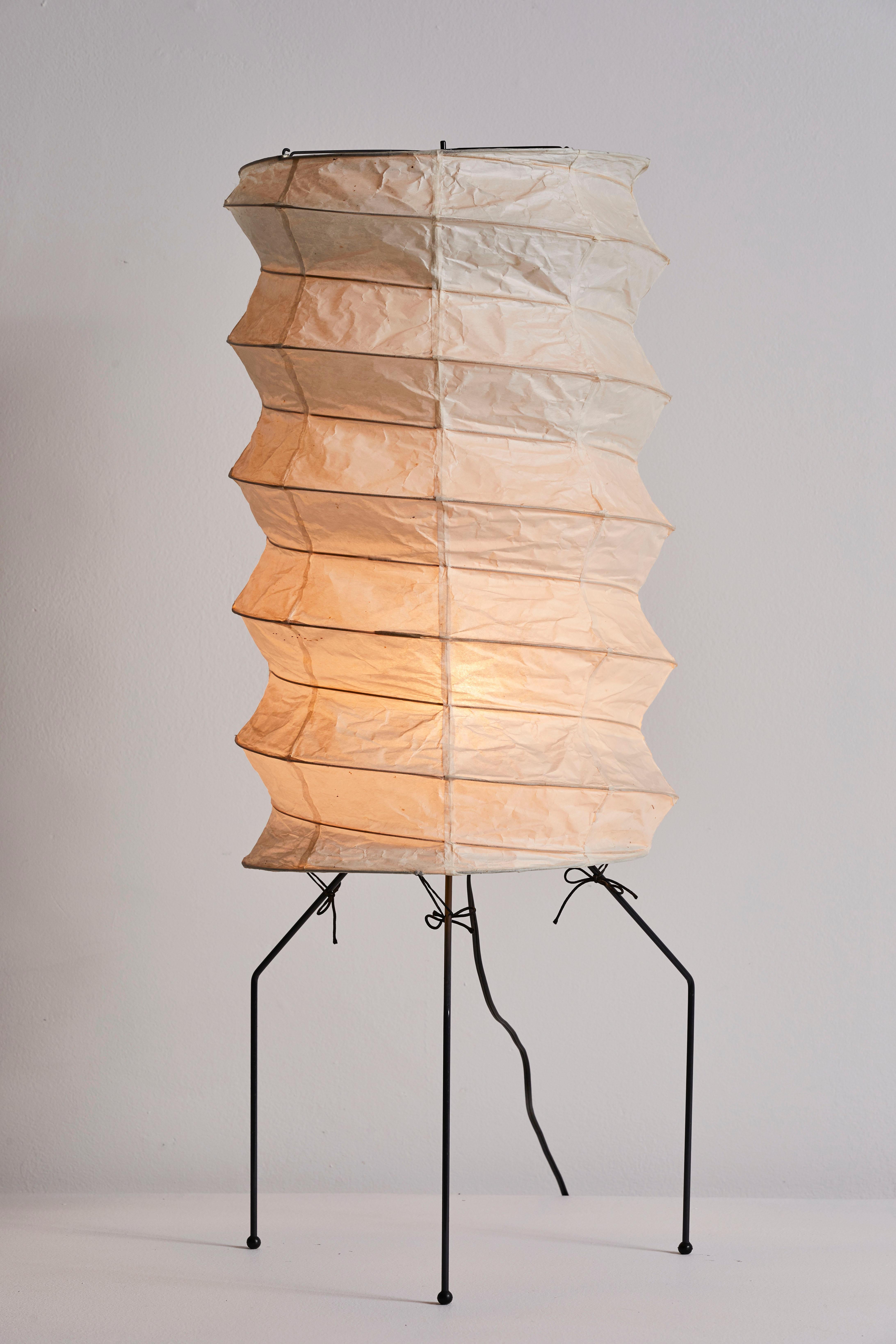 Model Number UF3-Q table/floor lamp by Isamu Noguchi for Akari. Out of model production designed and manufactured in Japan circa, 1980s. Rice paper, enameled metal. Original cord. Retains manufacturer's original stamp and Gemini Gel gallery sticker.