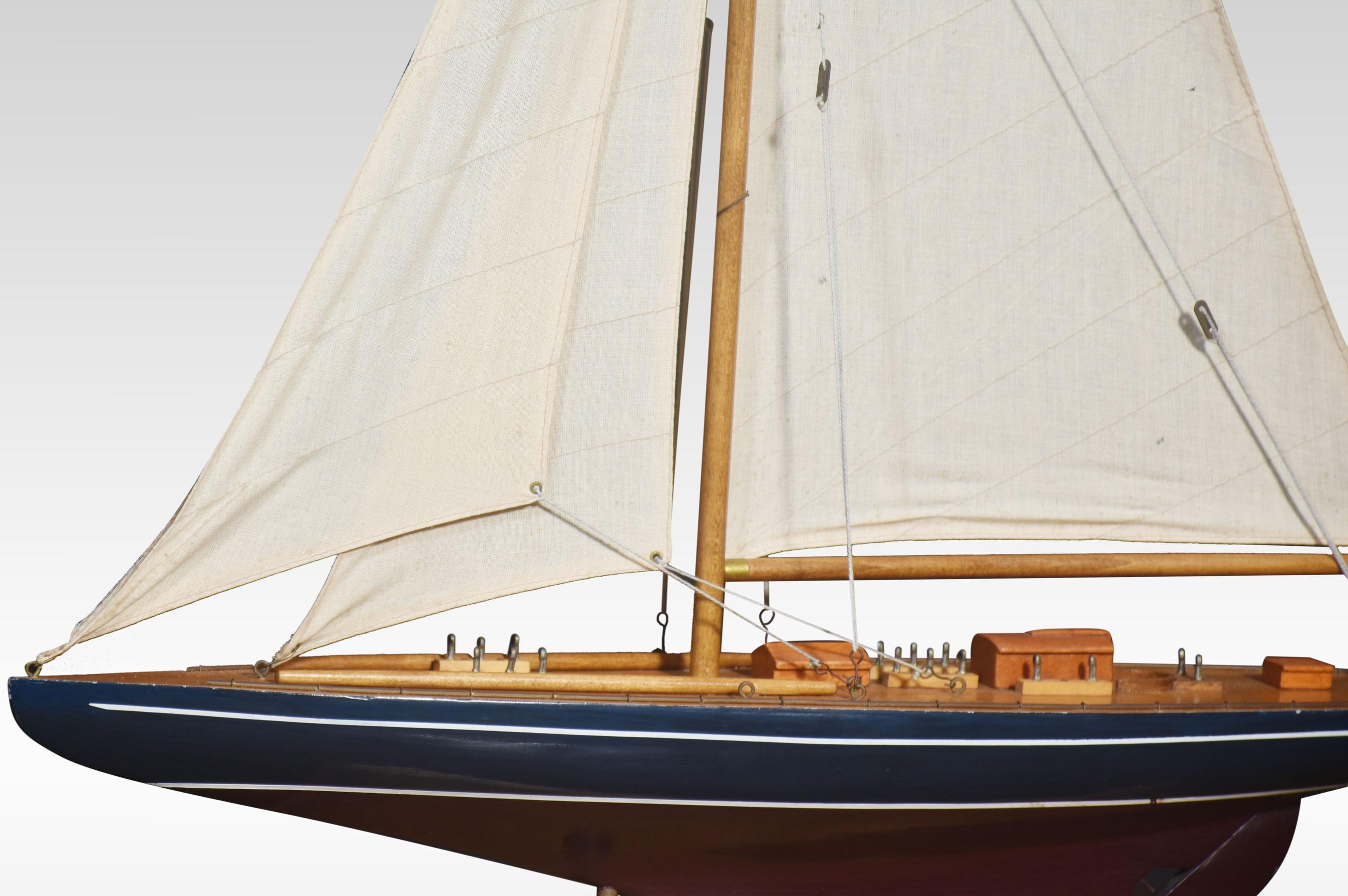 Model of a sailing yacht, painted in blue and red complete With three sails. All raised on a wooden base.
Dimensions
Height 34 Inches
Width 24 Inches
Depth 5 Inches