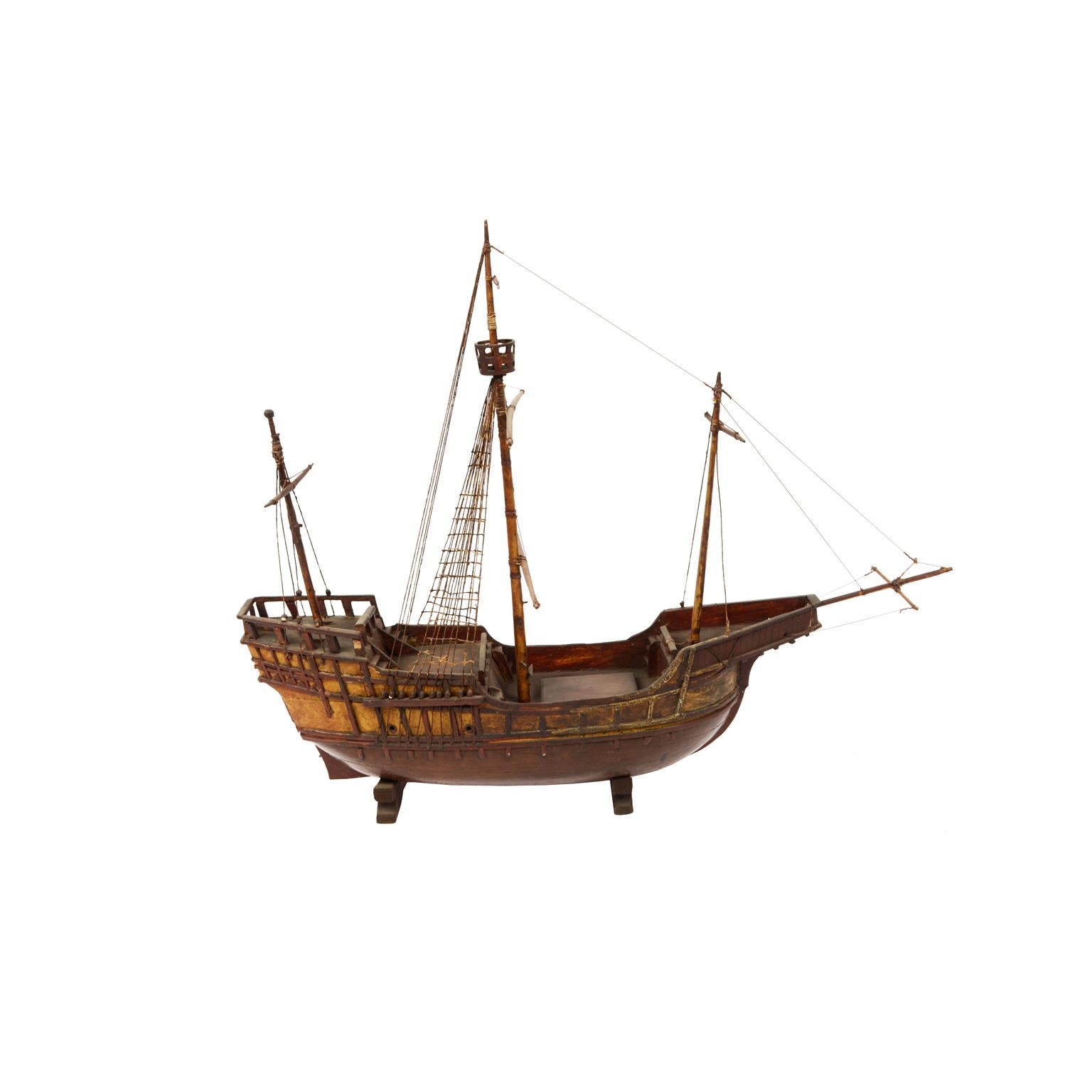 Wooden antique ship model of a cargo-carrack, probably from Genoa, with three masts, end of the 19th century. 
Very good conditions. Measures: Length cm 70 - inches 28, height cm 56 - inches 22.

The carrack or nao (both terms mean simply 