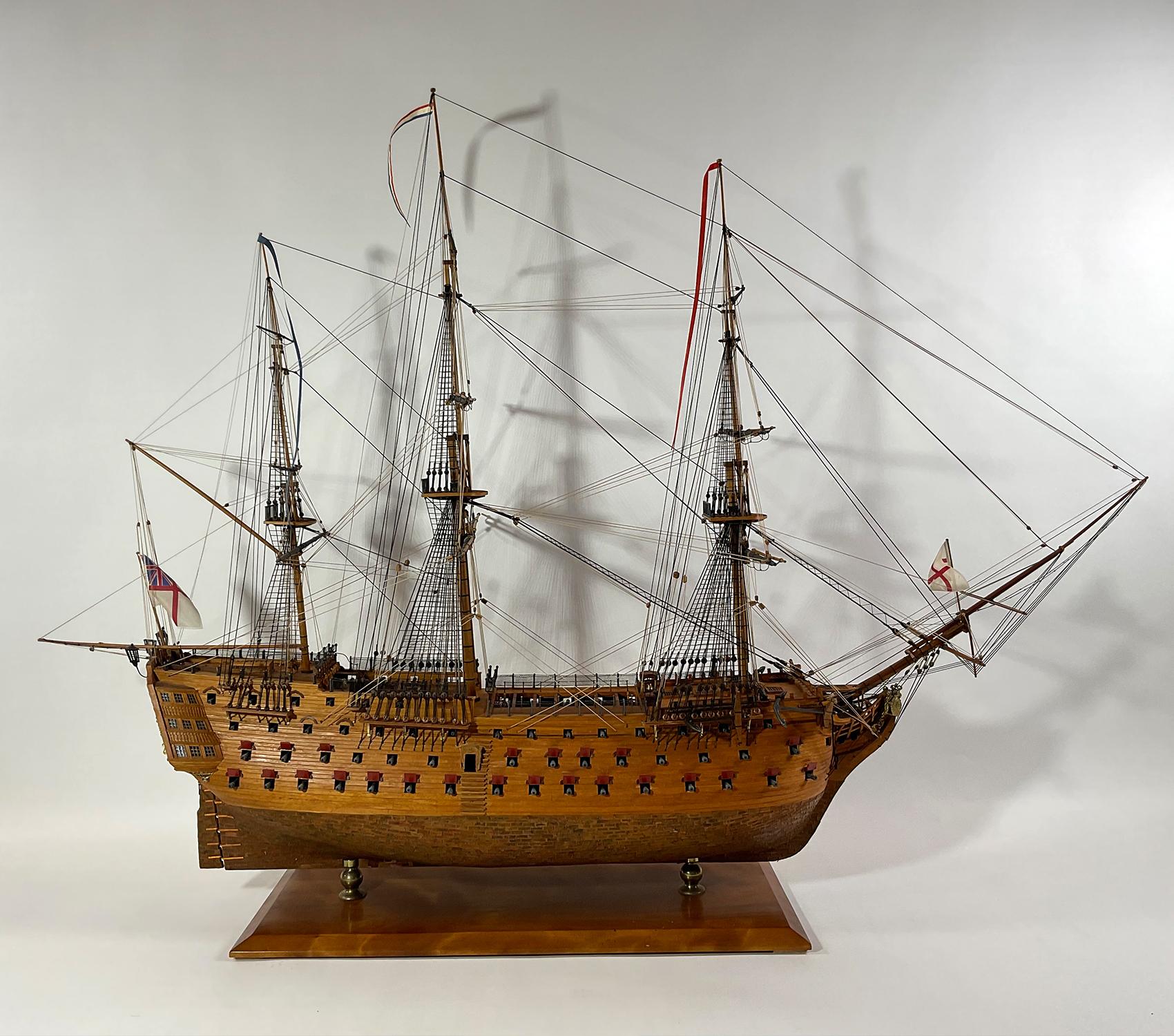 Plank on frame model of the famous English warship HMS Victory. This model is planked in varnished walnut above the waterline and copper sheathed below. Fully rigged with all appropriate cords. Awesome workmanship on this stately vessel. Countless