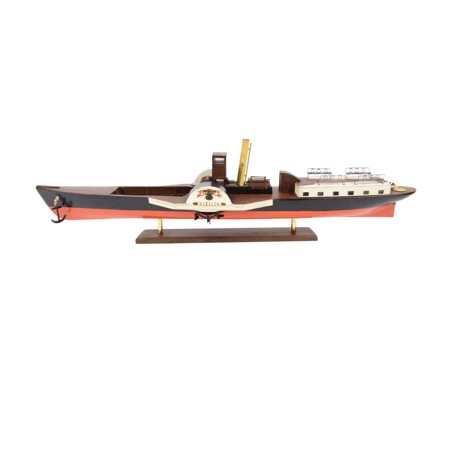 Model of the Danish steamer Hjejlen, the oldest original coal steamer in the world, still operating from May to September from Silkeborg to Himmelbjerget. Partly painted mahogany planking hull, red hull, black topsides. The steamer was commissioned