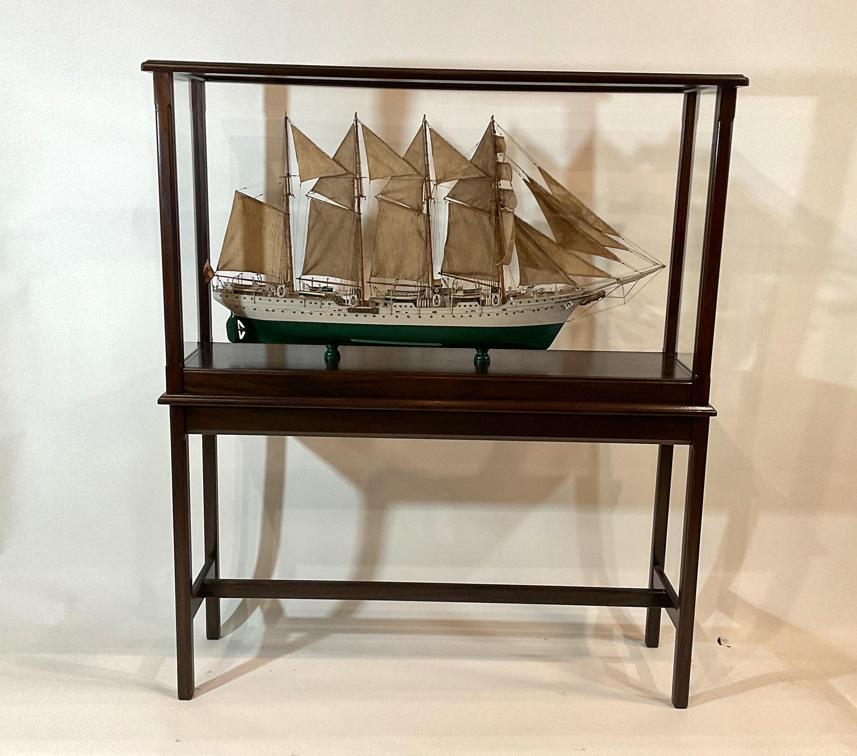 Scale model of the Spanish navy training ship Juan Sebastian de Elcano. Model is Circa 1940 and has cracking paint. Rigged with a full suit of sails that are aged and stained. Distressed condition but a salty decorative piece.

Weight: 90