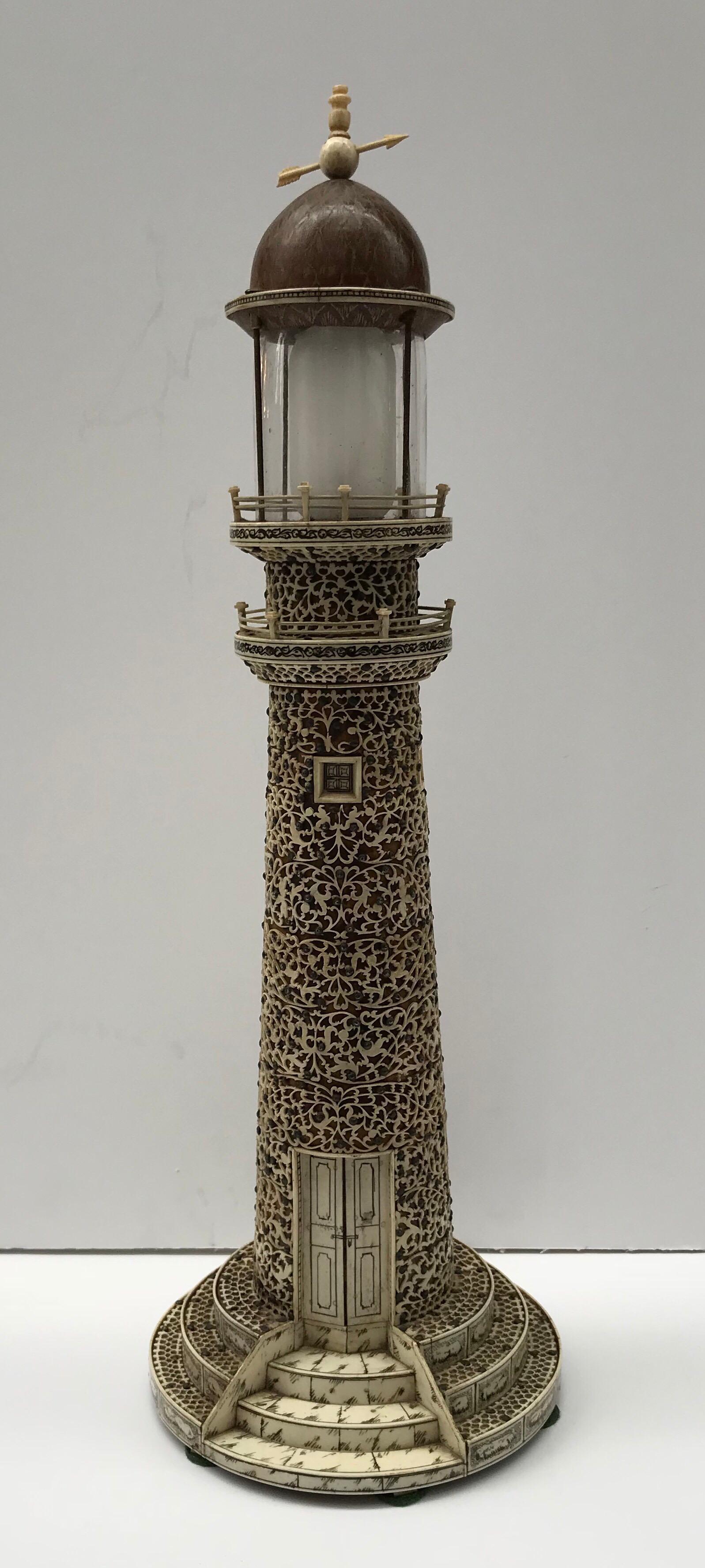 Rare late 19th century Indian bone and faux tortoiseshell model of the Visakhapatnam lighthouse with carved bone arrow weathervane over etched and polished coconut husk dome over galleried searchlight platform, the body overlaid with pierced bone