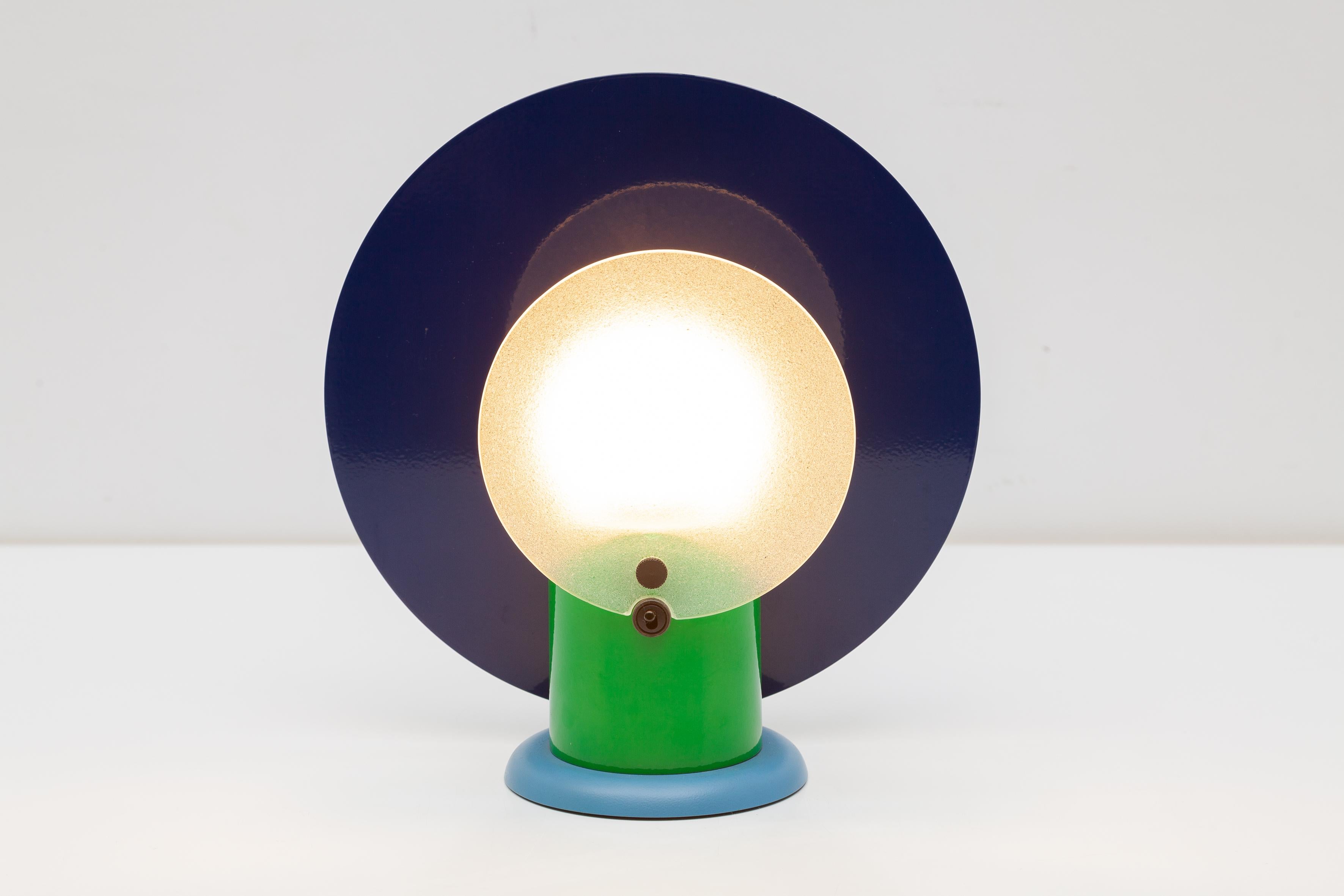 Vintage table lamp by Beiffeplast, Italy. Bold 1980s design with blue and green enameled metal and textured glass shade. Spiky rubberized light bulb.Dimensions:27 x 25 x 12 cm.Perfect Condition.