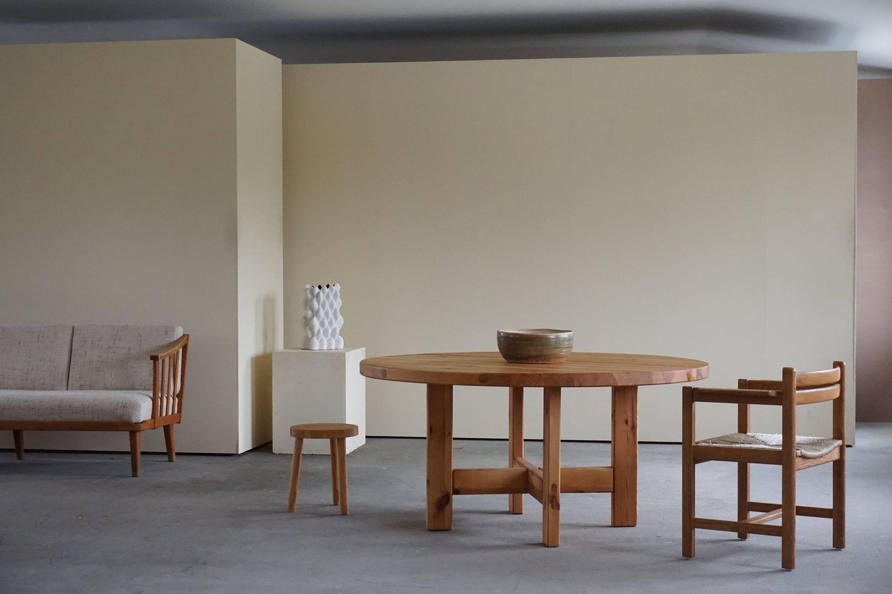Swedish mid century large round dining table made of solid pine. Design by Roland Wilhelmsson for Karl Andersson & Søn. 1970s. Model RW 152 
The table is beautiful patinated and show a minimal signs of wear.
