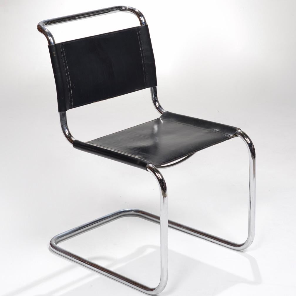 Original black leather and bent chrome model S33 dining chairs by Mart Stam for Fasem, Italy 1970s. These have a cantilevered tubular metal frame, with a leather backrest and seat. The leather has a beautiful patina. These chairs are in wonderful