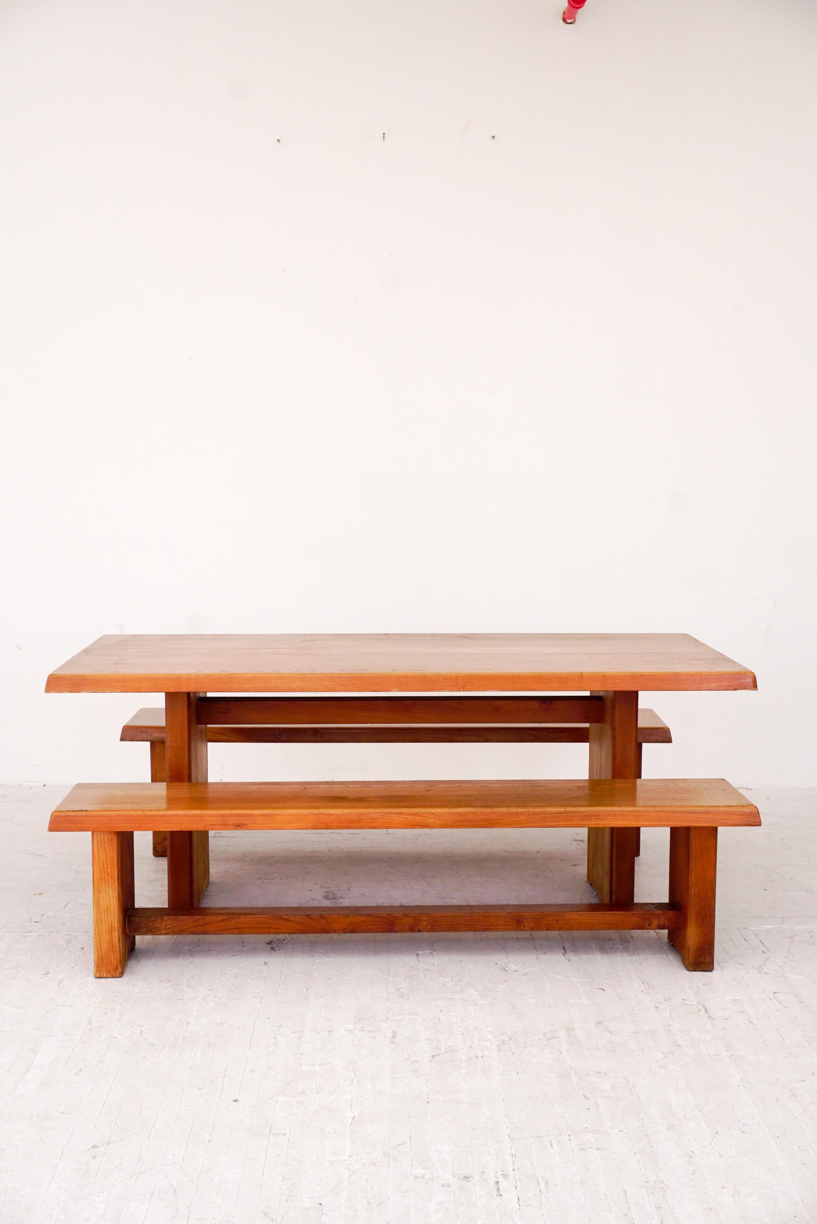 Extremely sturdy example of a vintage elmwood table and benches by Pierre Chapo designed 1960. 

Handmade joinery on table and bench ends and metal connectors with patina. 

Would be willing to separate benches and table.

Table only: