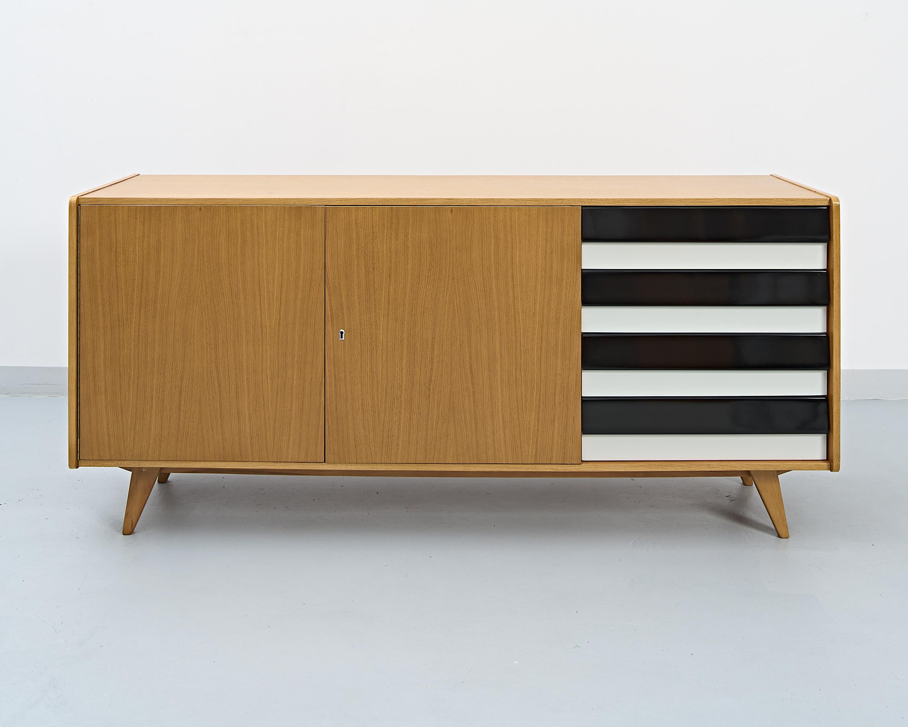 The U-460 sideboard designed by the czech designer Jiří Jiroutek as a part of the U series. Works began after the enormous success of the Czechoslovakian pavilion at the Brussels ’58 expo and the series became one of the leading examples of the