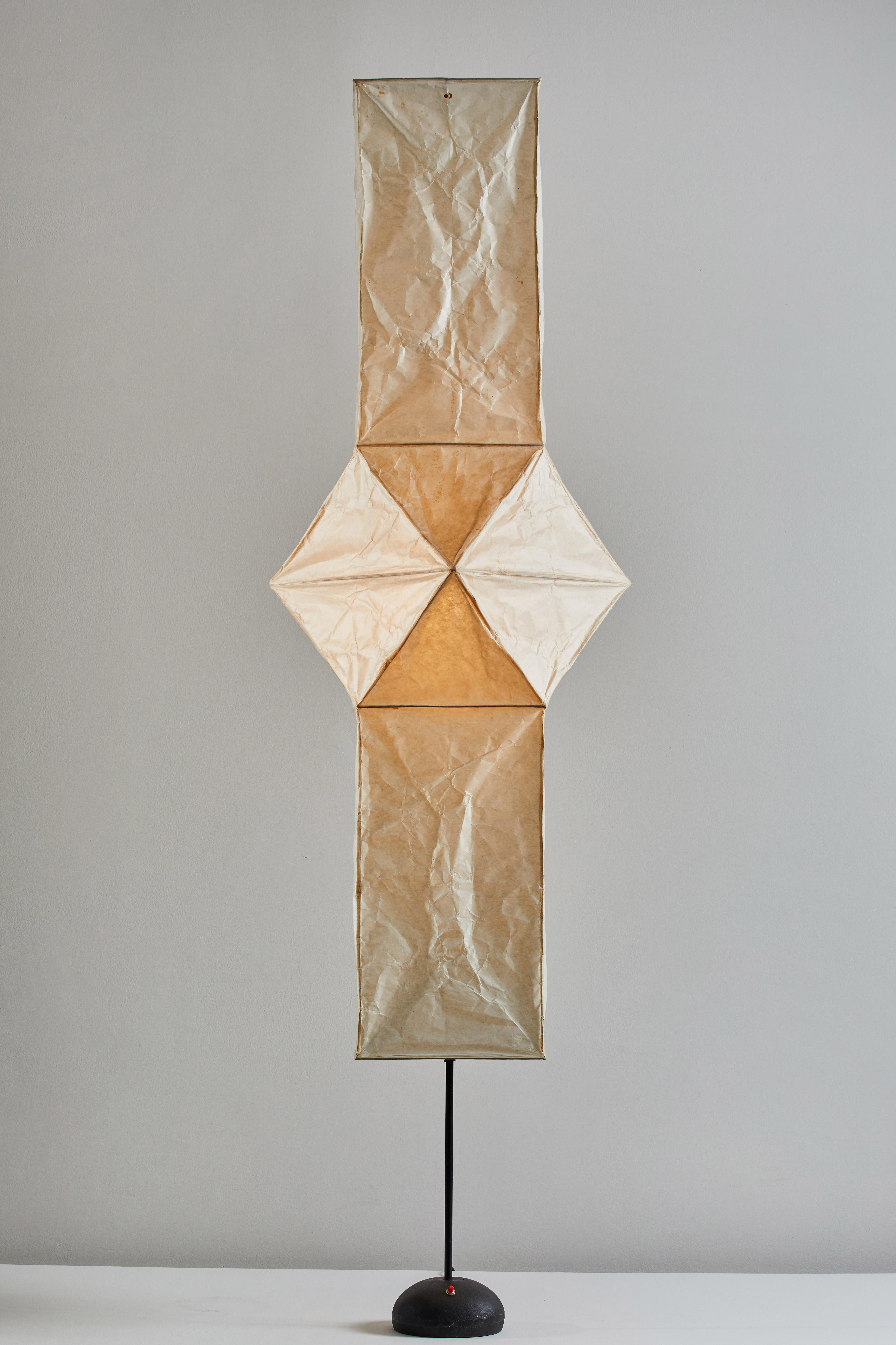 Model UF4-L5 floor lamp by Isamu Noguchi for Akari. Designed and manufactured in Japan circa 1970s. Washi rice paper, bamboo ribbing, enameled metal frame, steel base with signature. Original Sun/Moon stamp. Takes one E27 75w maximum bulb. Bulbs