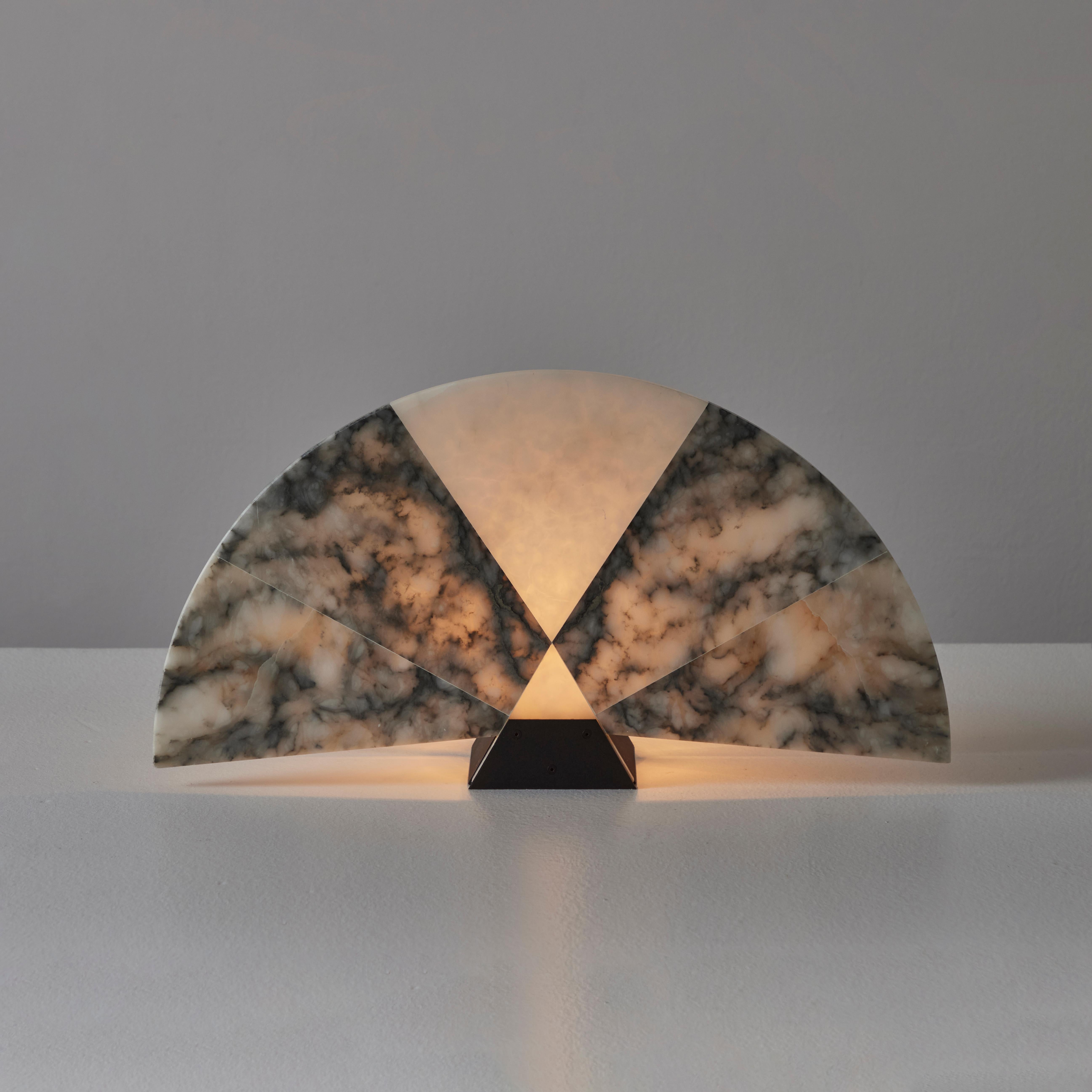 Model V584 'Ventaglio' Table Lamp by Angelo Mangiarotti for Skipper Pollux. Designed and manufactured in Italy, circa the 1980s. A multi-faceted marble fan is paired with a steel mounting bracket to form a stunning minimal table lamp. The lamp holds