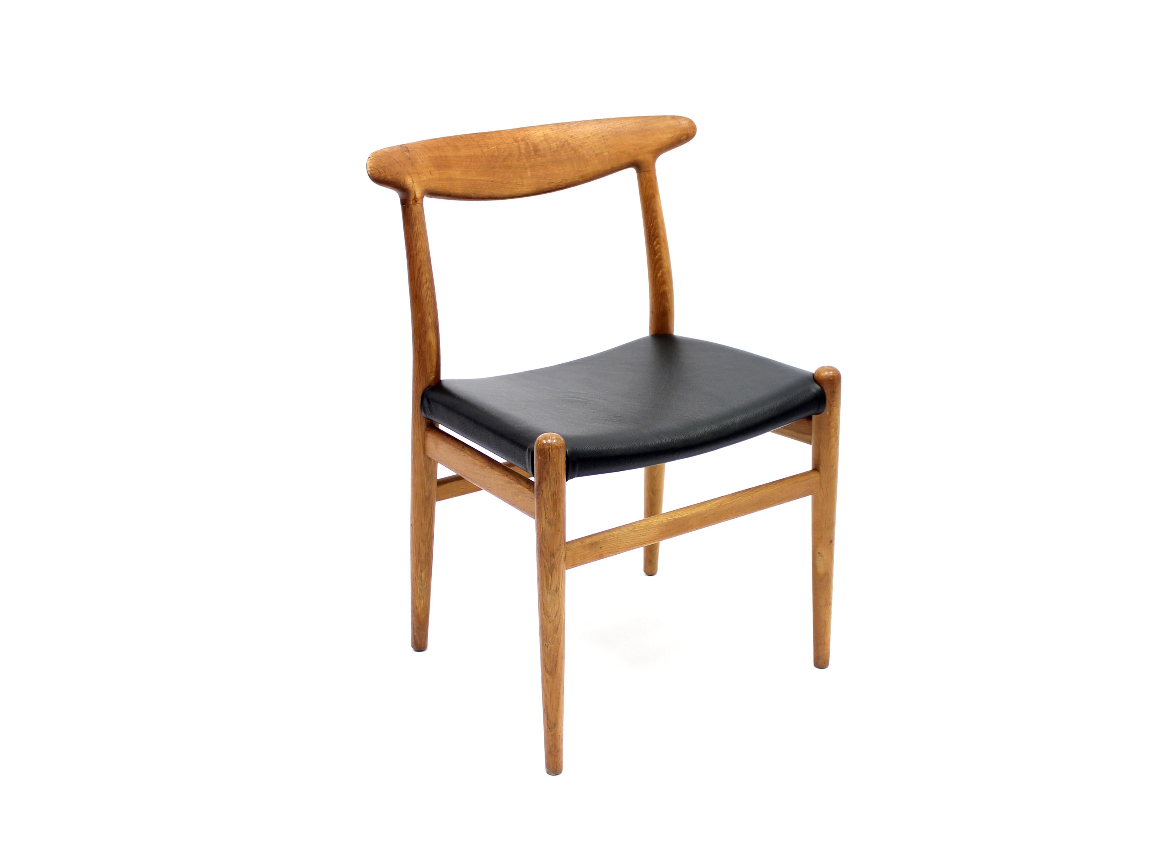 Chair, model W2, designed by Hans Wenger for C.M. Madsen. Frame in smoked oak with new black leather seat. Light ware and patina on wooden parts.