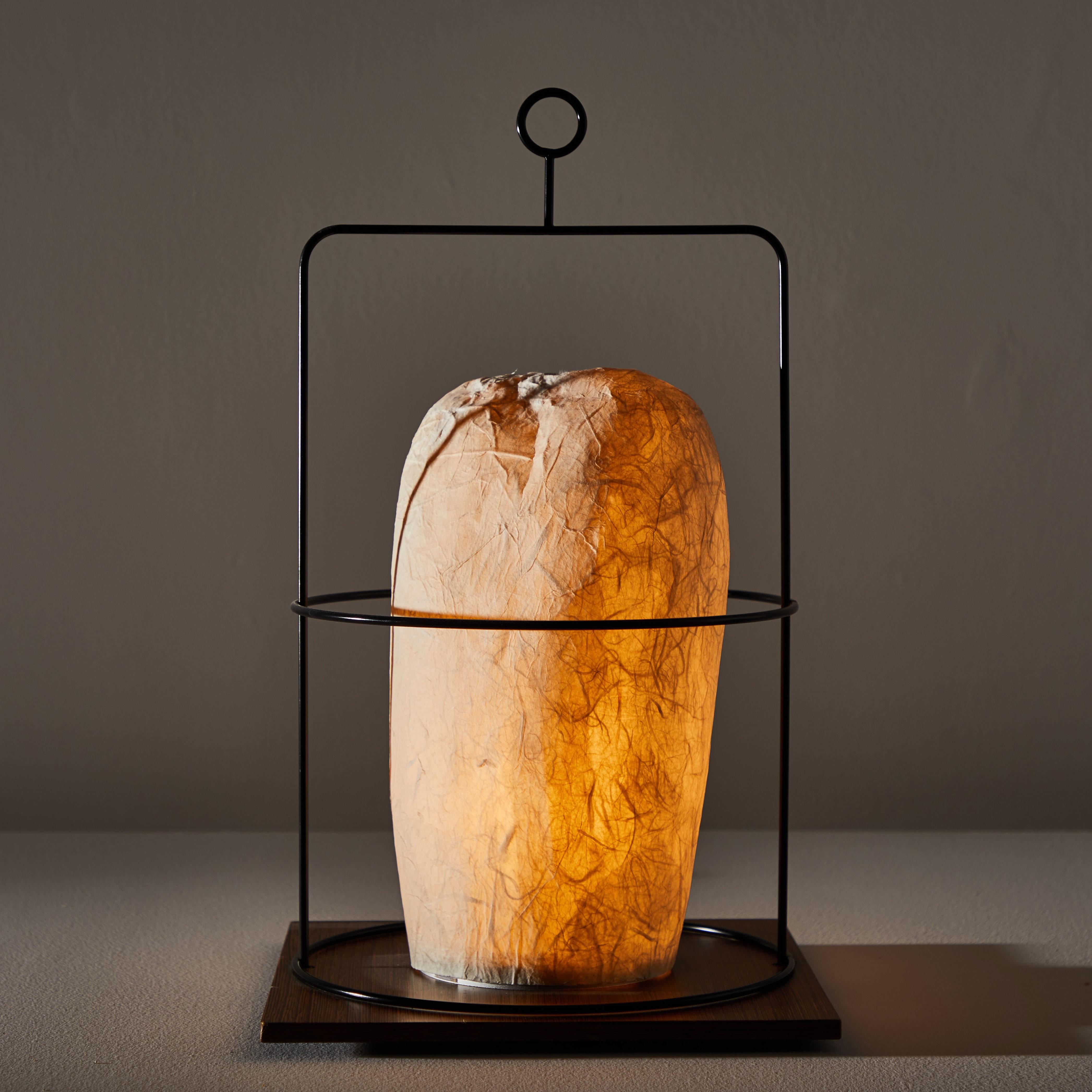 Model WL 01 D table lamp by Andrea Branzi. Designed and manufactured in Milan, 1995-1996. Black metal wire, wood, rice paper. Original cord. Takes one E27 25w maximum bulb. Bulbs provided as a one time courtesy. Literature: Fiell, Charlotte & Peter,