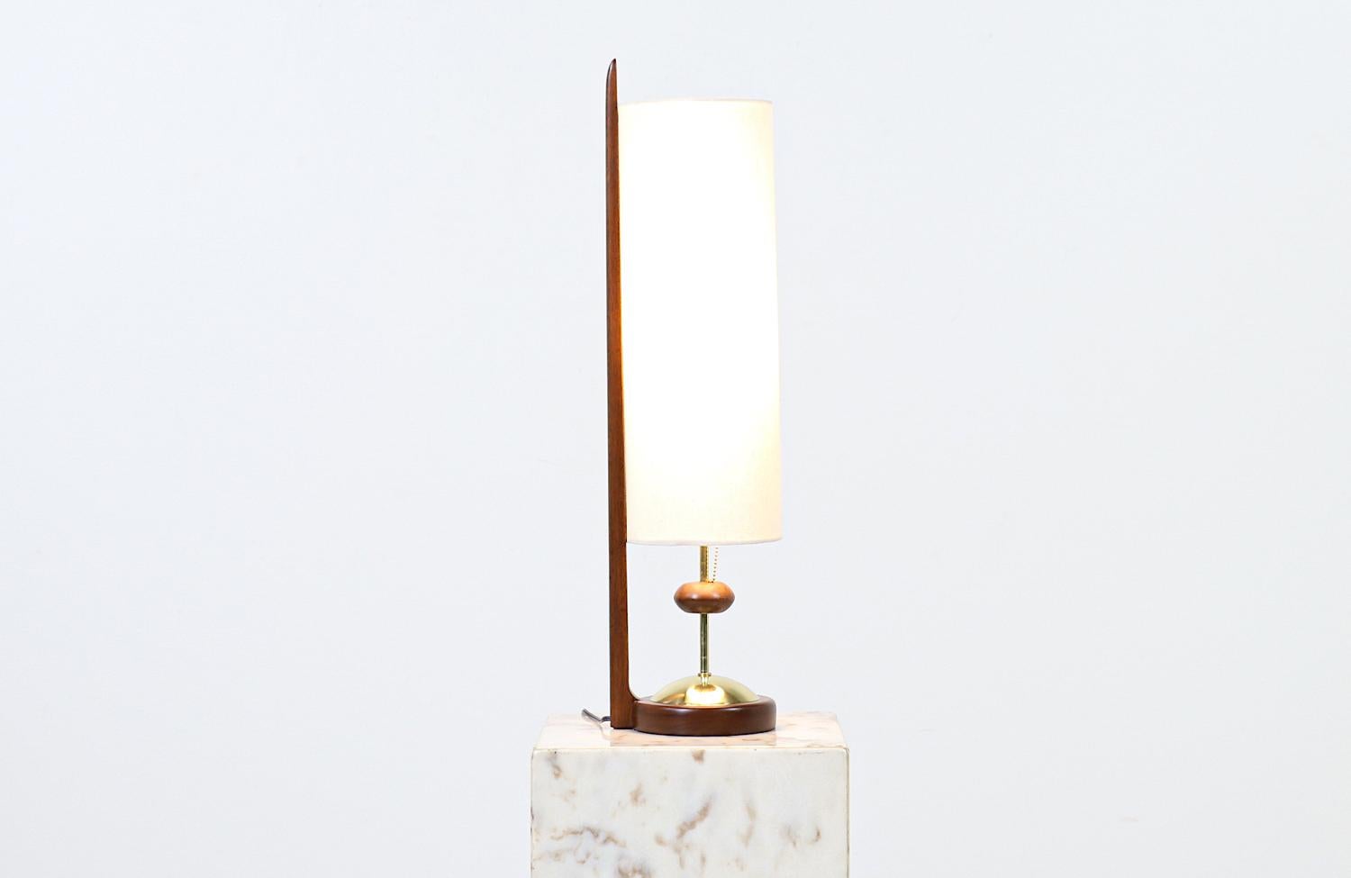 Modeline of California modern sculpted walnut table lamp.